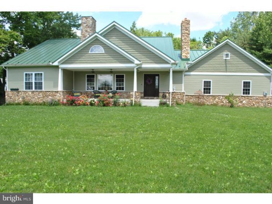 Looks are not deceiving!  This really is your dream home.  Two year old Amish built craftsman 3 Bdrm/2 Bath home with unfinished basement and walkup attic plumbed and ready for expansion.  Open concept kitchen has stainless appliances, double drawer dishwasher, oversized refrigerator plus 6 burner stovetop with built-in griddle and a double wall oven.  Handcrafted cabinets galore!  The butcher block counter comfortably seats five.  Roomy Master suite opens to the back porch overlooking beautiful setting.  Ceiling fans throughout home as well as on the front and back porches.  Central air with propane heat or an efficient coal stove.  Lifetime standing seam painted steel roof.  There is a two story double bay barn (as is); perfect for the woodworker or mechanic.