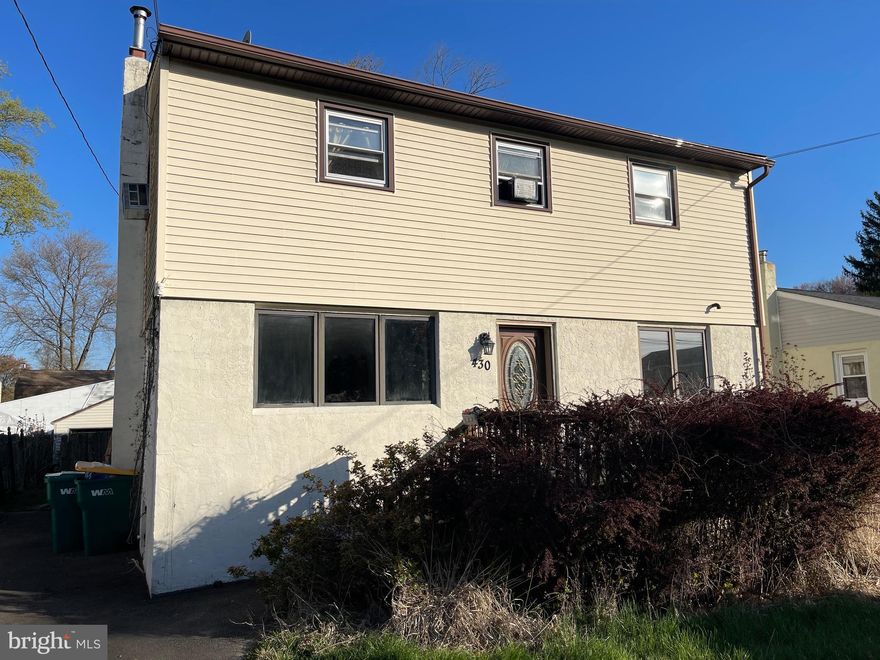 No - I did not make a mistake! This is a great 4 bedroom colonial over 2000 sq ft in the quiet Langhorne Gables neighborhood. A hard to find main floor bedroom with full hall bath and open flow from updated kitchen with granite counter tops to the Family Room. The Living Room with large picture window complete this level. On the second floor is 3 spacious bedroom with laundry room  and full bathroom with double sink vanity. Outside is a rear deck that steps down to a paver walkway that leads to a paver patio with wall seating around a built-in firepit. Detached garage and 4 car deep driveway and Low Taxes are part of the package. Home is As-Is. Bring your contractor and personal touches.