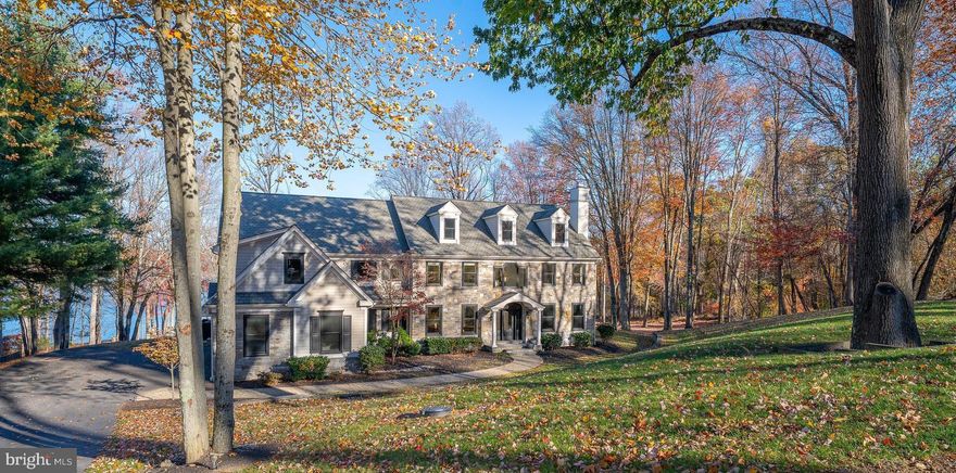 RARE EXECUTIVE WATERFRONT LUXURY ESTATE RENTAL
SETTING:   Private Waterfront Estate on the Springton Lake Reservoir presenting a rare opportunity for the discerning tenant.  Discover the combination of luxury and sanctuary living on 1.58 acres with 309 feet of  reservoir frontage – a rare protected watershed where nature performs daily,  yet minutes from downtown Media and Newtown Square’s acclaimed restaurants and shops,  the Main Line,  Philadelphia International Airport, and major highways (476, I-76, Route 1 and I-95) into Phila, NYC and Wash DC.   This 8559 sq ft  meticulously maintained 5-7 bedroom executive rental is available as a furnished home with flexible lease terms up to 12 months.   With spectacular views of nature year round,  you'll always feel as though you're on vacation, whether waking up to morning sunrise on the reservoir, working from the handsomely appointed office on the main level as you watch a family of deer,  or indulging in your favorite hobby on the expansive third level, the serene views are everywhere.  
MAIN LEVEL: Enter into the dramatic two-story foyer flanked by formal living room with gas fireplace and elegant formal dining room both featuring custom wood inlays and the nearby private custom cherry office. The spectacular gourmet kitchen showcases oversized island seating,  Sub-Zero refrigerator, Wolf dual ovens/cooktop, and wine cooler,  flowing into the  breakfast room and family room with coffered ceiling and gas fireplace.   Two powder rooms  and a spacious mudroom with walk in pantry, utility and coat closets complete  main floor.
THE PRIMARY SUITE:  A personal sanctuary with cathedral ceilings, sun-drenched sitting room with private balcony overlooking the reservoir, his and hers walk-in closets, and a spa-inspired bathroom with radiant heated floors, jetted tub, and expansive glass shower. The adjustable bed with  14” mattresses allows viewing of the retractable television at the foot of the bed, while electric shades in both bedroom and sitting room offer one-touch control. A dedicated kitchenette area with refrigerator, coffee/tea station, and cabinetry for bottled water and snacks – enjoy your first cup without going downstairs.  Four additional generously-sized bedrooms  (two with new carpeting prior to move-in), each with a private en-suite bathroom and individual thermostat control ensures everyone in your household enjoys hotel-level privacy and comfort.  
PRIVATE IN-LAW SUITE: A separate 15' x 17' bedroom with adjacent private living room (13" x 15'6") featuring 65" TV and en-suite bathroom is perfect for multi-generational living, live-in help,  or can function as a 6th bedroom.  
THIRD LEVEL:  1,321 Square Feet of Possibility -  An entire floor (47' x 30') currently features professional studio lighting for zoom calls and a 65" entertainment center.   Adaptable as home theater, art studio, executive suite, hobby space or 7th bedroom. Adjacent unfinished  storage space (197 sq ft). 
LOWER LEVEL: The finished 1,271 sq ft walkout lower level features a  rec room with 65" TV,  regulation ping pong table, air hockey, board game collection, state-of-the-art home gym with Peloton bike and treadmill, temp-controlled 2,000-bottle wine cellar (empty, ready for your collection), and half bath.  Approximately 1,500 sq ft of add'l unfinished basement provides extensive storage (owners will use a portion) to  be freshly painted white prior to move-in.   The attached oversized 4-car radiant heated garage with epoxy flooring,  hot and cold water faucets makes daily life easier.  12 HVAC zones for efficiency and comfort, distributed mesh network provides robust WiFi access throughout.  
OUTDOOR LIVING:  Fire pit for roasting marshmallows under the stars, folding chairs and patio furniturefor waterfront sunsets, and yard games.  Please note: This is a quiet residential neighborhood. No loud music, parties, or outdoor noise after 10PM)     This is a special opportunity.