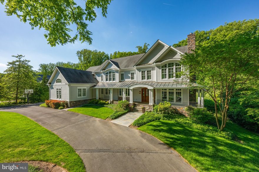 Welcome to this captivating residence in prestigious Langley Forest. A true masterpiece, this recently renovated home spans nearly 10,000 sq. ft. and offers an unparalleled living experience. It’s an entertainer’s paradise, complete with impeccably landscaped grounds, a stunning 60-foot pool with a waterfall, a beautiful pergola, and a cozy fire pit. Step into the spacious living areas where comfort and elegance meet. The foyer opens to a formal living room featuring a fireplace and a dining room with a convenient butler’s pantry that connects to the updated chef’s kitchen. The kitchen boasts a large center island, custom cabinetry, top-of-the-line appliances, and a walk-in pantry. The open family room features coffered ceilings and a stone fireplace, perfect for gatherings. On the main level, you’ll also find a library/office with built-ins, a second office off the kitchen, a full bath, and a laundry room. Upstairs, the owner’s suite is a retreat, featuring two custom walk-in closets and a spa-inspired bath with separate vanities. Four beautifully appointed bedrooms, each with its own private bath, complete the upper level. The fully finished lower level is an entertainer's dream, with a recreation room that has a stone fireplace, a game room, a wet bar, a fitness room, a custom wine cellar, and an additional bedroom with a full bath. The home features an integrated speaker system that extends throughout, including the front porch and backyard. With ample space and seamless flow from indoor to outdoor areas, this residence is perfectly designed to host gatherings for 200+ guests.
