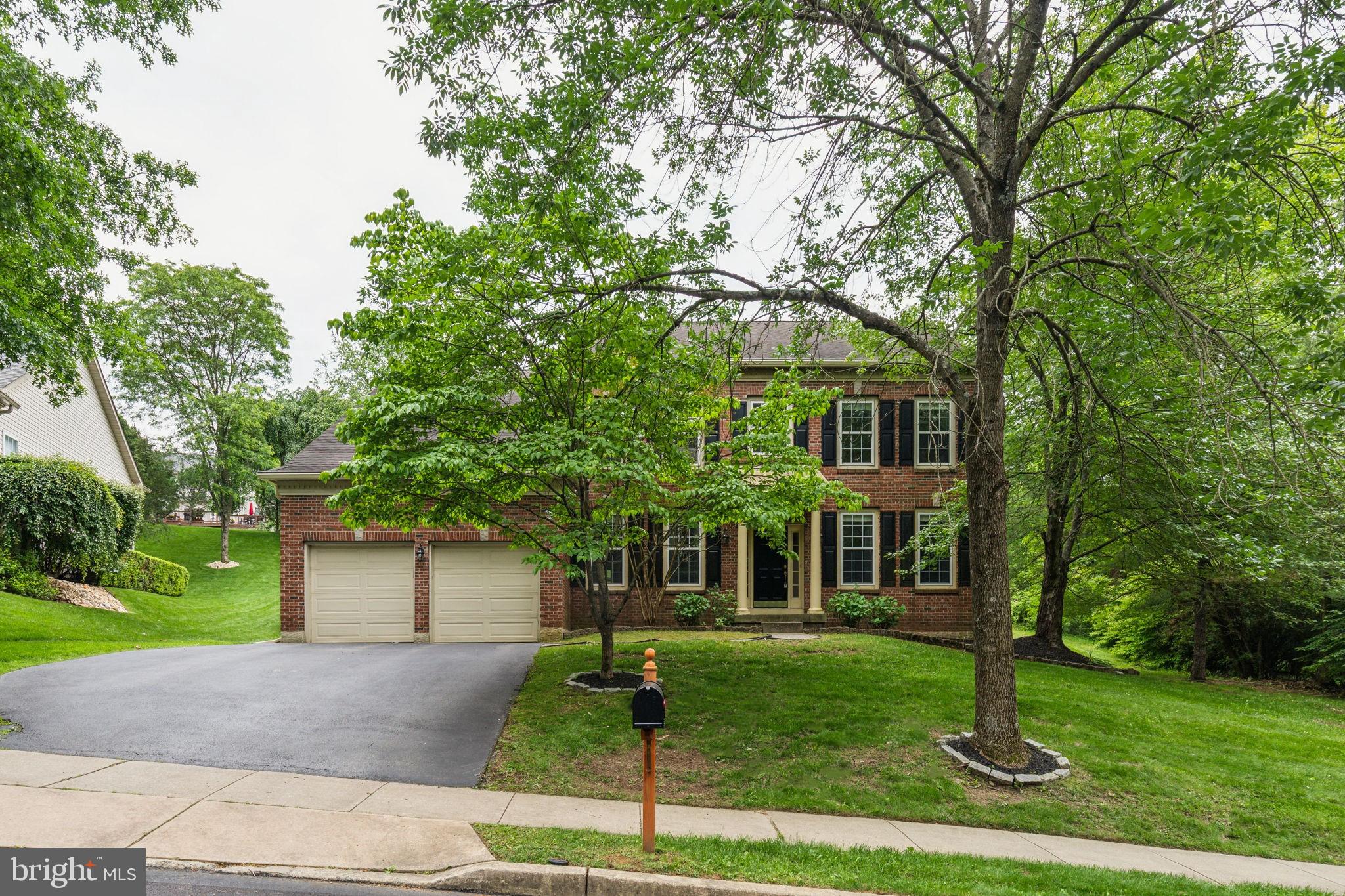 Welcome to 702 Iris Lane located in the desirable Old Mill Pointe neighborhood. Just a short drive from Media Borough and within the award-winning Rose Tree Media School District, this beautiful brick colonial has so much to offer! With over 4,000 square feet of living space, this Single Family home has 4 bedrooms, 2 full baths, 2 half baths and so much more.
Enter through the front door to be greeted by a central two-story foyer, with a spacious formal dining room (great for entertaining) located to the left. Just off the foyer is the lovely formal living room, a powder room and a large office or den with built-in shelving. In the center of the home lies your traditional kitchen, with updated stainless steel appliances, stone countertops and all the cabinet space you could dream of. The kitchen opens to a lovely eat-in area and family room adorned with a gas fireplace, soaring ceilings and with a wall of windows looking out onto your fully fenced backyard with private access to the Chester Creek Trail. Finishing off the first floor is a cozy sunroom providing year round enjoyment. For your convenience, there is a first floor laundry room with utility sink and additional storage closet located off of the two car garage entry.
Head upstairs using either of the two staircases and you’ll find three large bedrooms and a hall bath with double vanity sinks and a linen closet. Each bedroom is spacious, with plenty of storage and wonderful natural light. The large primary suite, located at the end of the catwalk, open to the family room below, includes two walk-in closets and an ensuite bathroom with walk-in shower, double vanity and soaking tub.
The finished basement offers even more additional living space for whatever you desire. There is a modern tiled powder room for your convenience, walk-out access and additional storage. Not only does this home offer the space you need, it provides newer mechanicals for peace of mind. The home has been fully painted and freshly landscaped, allowing you to move right in. All with convenient access to Philadelphia International Airport, Center City and the Mainline