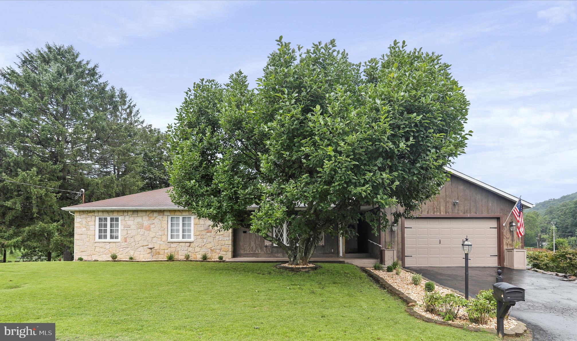 Seller is open to contributing to closing costs.
HURRY!!! This executive stone ranch sits on a 1.17 acre level lot in the heart of LaVale!!! This home has undergone a major 50k+ renovation including: the making of a primary master suite complete with a walk-in closet, pocket doors, and electric fp w/ tv mounted about it, and gorgeous full bath w/ a walk-in shower/mirror w/ adjustable lighting, and pocket doors, new LVT flooring in kitchen/LR/foyer, laundry moved upstairs to make seamless main level living, updated lighting, new gas furnace +A/C in May '24, new kitchen appliances in April '23, new toilet in powder rm, new garage door opener in OVERSIZEd garage, fresh paint inside and on deck, many updated 6 panel doors, extensive landscaping upgrades. But wait, there's more! How about the workshop space with exterior entrance from rear of home, the LR large enough for a baby grand piano AND any large sized furniture you wish, tons of storage space, room for a 3rd bedroom is you need it, a dining room fireplaces as well as one in the family room, beautiful hardwood flooring, built-ins in lower level family room w/ bar, lower level 3rd full bath, LR w/ French doors leading to large rear deck, pass-through window from kitchen to DR. Plenty of room for a pool, a second garage, a play area and whatever else you desire! An added bonus is a well on the property used for watering flowers and washing cars!