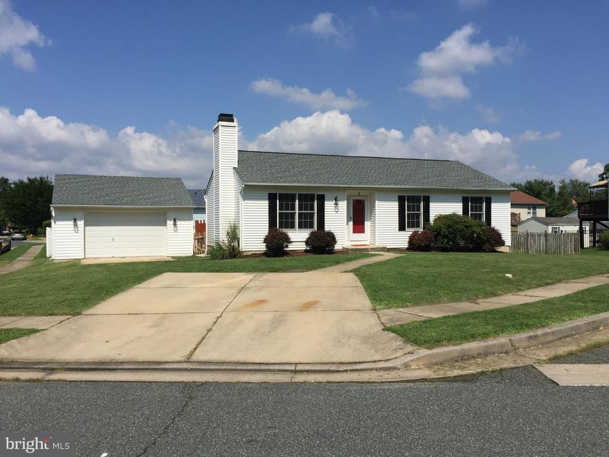 Beautifully renovated ranch with new roof, new hardwood floors, new paint and carpet, new ceramic baths, new kitchen with granite bar and stainless appliances. Living room fireplace, fully finished basement and sliders to a rear deck for your summer entertaining. All this and a huge detached garage!!
