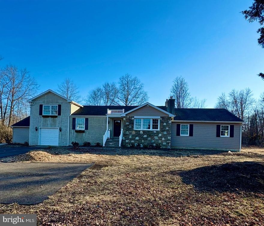 Expanded cape with tons of potential.  Hardwood flooring in most rooms.  Updated kitchen with granite counters, built in micro and plenty of cabinets.  Large foyer opens to a formal living room with stone fireplace (non working) and triple windows providing plenty of light.  Three steps down to newer addition with 2 bedrooms, study area - all with hardwood flooring, and a full bath with tile flooring, linen closet and single vanity.  The kitchen features shaker style cabinets, and windows provide views of the large rear yard.  This room is open to the family room creating a large space for dining, relaxing and gathering.  Outside the kitchen/family room is a covered deck.  The sunroom is a few steps down from the family room and features tile flooring, and provides access to both the yard as well as the garage.  Access to the basement is through the garage.  The primary bedroom is a half flight up from the main level.  This room needs some finishing - carpet needs replacing and some drywall work is required.  Primary bath has jetted tub and stall shower.  An added plus is the in-law suite with private entrance.  This suite could be perfect as a home office, or guest suite.  Kitchenette, living room, bedroom  and full bath complete this space.  The yard is spacious and features a small pond and stream and gardens with perennial plantings.  With some sprucing up the yard could be quite lovely.
Professional photos to be uploaded by end of the week.