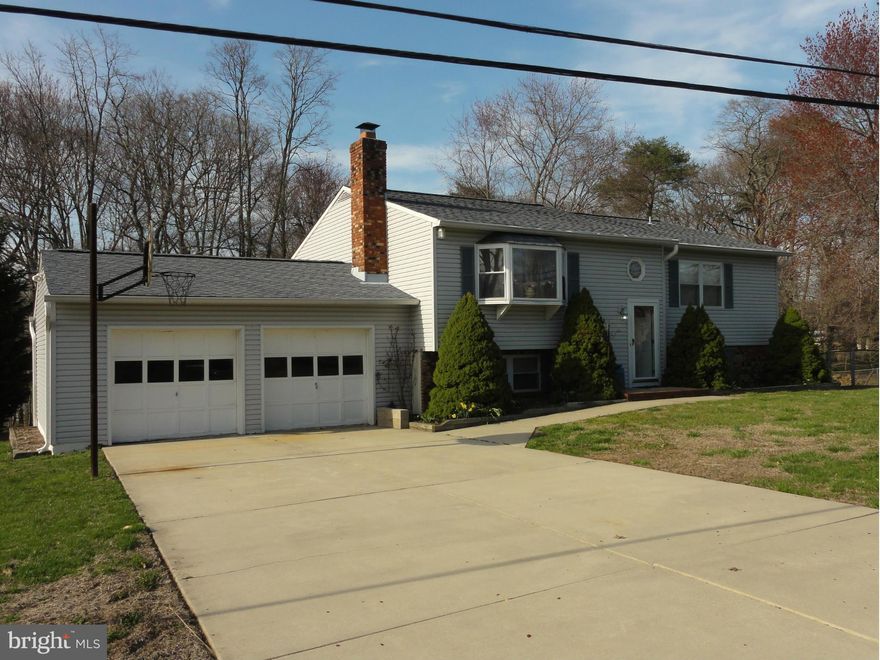 NEARLY AN ACRE! FANTASTIC CORNER LOT! LARGE, ATTACHED 2 CAR GARAGE!LARGE HOME WITH FULLY FINISHED WALK-OUT LOWER LEVEL. LOTS OF MAJOR IMPROVEMENTS IN RECENT PAST INCLUDE: HEAT PUMP, ROOF, WELL PUMP, VINYL SIDING, SEPTIC SYSTEM, REMODELED BATHS, NEW SLIDERS AND MORE! RELAXING DECK OFF EAT-IN KITCHEN SLIDERS.