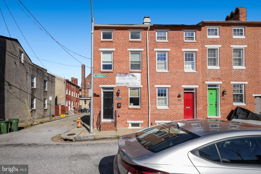 STUNNING END-OF-GROUP RENOVATION LOCATED IN THE HEART OF FEDERAL HILL WITH GARAGE PARKING NOW AVAILABLE. 13+ FT WIDE. GLISTENING HARDWOODS CASCADE THROUGHOUT. ENJOY CUSTOM CABINETRY, EXPOSED BRICK, IMPORTED TILE, GRANITE COUNTERTOPS, SS APPLIANCES IN DESIGNER CHEF'S KITCHEN. TONS OF NATURAL LIGHT. FINISHED LOWER LEVEL. HIGH CEILINGS. TONS OF STORAGE. WALK-IN SHOWERS. WALK-IN CLOSETS. GREAT LOCATION. SPACIOUS 3 BEDROOMS WITH 3.5 BATHROOMS. EXPANSIVE DECK - GREAT FOR ENTERTAINING. CLOSE PROXIMITY TO RETAIL SHOPPING, LOCAL DINING, AND ALL MAJOR HIGHWAYS.