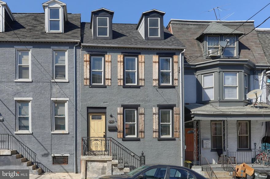 This stunning historic home was a total renovation project in 2021, complete with a new kitchen, 2.5 bathrooms,  replacement windows, HVAC system, 200 amp electric, and roof!  From the granite countertops to the custom vanities, to the exposed brick, you'll love this one!  Home was converted to an open floor plan with over 2300 square feet, and boasts two staircases as well. The current owners added new flooring on the first floor, and a completely fenced in rear yard 2 years ago, plus there's off street parking for 2 cars, a rare find in the city!  All stainless appliances remain, as well as the washer and dryer which are conveniently located on the second floor.  Original hardwood floors beautify the second floor as well!  You are just 2 blocks from the square and the Marriot Convention Center, and a short walk to shopping, the Central Market, the Fulton Theatre, and the downtown business district.