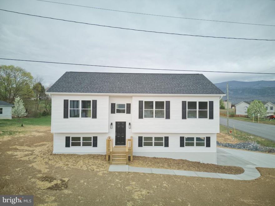 Brand-New Home with Stunning Mountain Views & Modern Finishes! Welcome to this gorgeous new construction home, offering breathtaking mountain views and modern upgrades throughout. With over 1,900 finished square feet, this home provides ample space, stylish finishes, and a functional layout designed for comfort and convenience. Key Features: Spacious open floor plan with abundant natural light. Luxury Vinyl Plank (LVP) flooring throughout for durability and style. Sleek granite countertops in the kitchen, adding elegance and functionality. Three full bathrooms, thoughtfully designed with modern fixtures. Large downstairs flex space, perfect for a family room, home office, or guest suite, plus a separate storage room. Expansive back deck, ideal for relaxing or entertaining while enjoying the mountain views. Oversized 2-car garage with windows, offering both parking and extra workspace. Situated on a large lot, providing plenty of outdoor space for recreation and gardening. This home is truly move-in ready, blending contemporary style with a peaceful, scenic setting. Don’t miss your chance to own this brand new stunner—schedule a tour today!