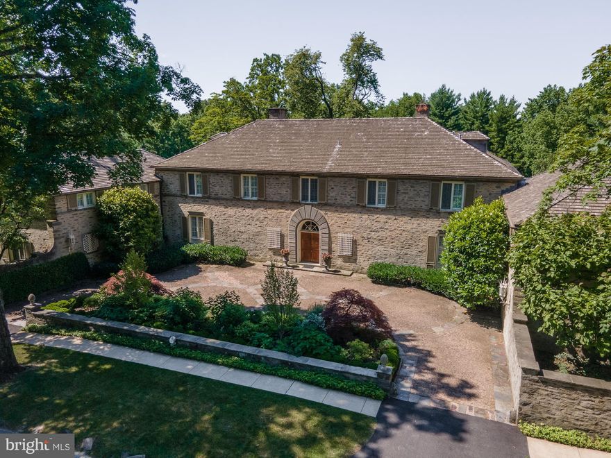 Presenting one of Chestnut Hill s premiere estates.  La Primavera:  the name evokes   a light and happy aura   spring.    Robert McGoodwin s design for the idyllic site on the edge of the park reminds a viewer of an Italian hillside villa, but only when viewed from behind.  From the street, a protected court shows only a discreet arched entry door and a simple rusticity with only a hint of Italian precedents.   This Italianate country house sits on app3.28 acres of land with the most beautiful views of the Wissahickon Valley and Fairmount Park.  With its tall trees and open tiered lawns, superbly built stone walls, multiple terraces and low maintenance planting it is an idyllic setting for any house.  Meticulously maintained during their ownership, these Sellers are proud of keeping this property up to the standard that it deserves.  The grounds, the trees, the pool, the tennis court, the cottage, and the systems have been painstakingly overseen over the years and it shows!  This is in many ways a perfect sized house with two floors of living space, yet room for home office, storage, hobbies, and relaxation.The front cobblestone courtyard welcomes you with a newly refurbished landscape plan by Elise Geyelin.  The double door entrance with arched window above opens to a lovely entrance hall with a  limestone floor.  The entrance to the grand formal Living Room with fireplace and three sets of French doors draw you to the spectacular green woodland view beyond.  The first floor plan is balanced with a stunning Library with built-in bookshelves, fireplace, parquet floor and exquisite original detail.  On the other side of the Living Room is a similar sized Dining Room, also with fireplace.  Both of these rooms extend out to two separate Sun Porch Rooms which take in the dramatic views of Fairmount Park.  There are all the additional spaces one needs for comfortable living including the powder room,  large mud room, multiple closets, and Pantry with original glass cabinetry and every amenity which add to this perfect first floor layout.  But the heart of the home is truly the Kitchen.  With its four exposures, it is constantly filled with exceptional light and cheeriness from sunrise to sunset.  Custom built cabinetry, granite counters, and every appliance possible including a Viking commercial six burner gas range with double ovens and hood,  SubZero refrigerator/freezer,  two sinks and additional wall ovens and microwave.   All are in an open setting with a large comfortable Family Room.  The layout of the first floor is perfect for small, medium and large scale dinner parties and entertaining.  The house embraces entertaining with its intimate areas and flow.The second floor has five main bedrooms, two are suites with fireplaces, dressing rooms and their own bathrooms. All bedrooms have finished hardwood floors beneath the carpeting, summer doors and ceiling fans for warm summer nights.  The Guest room wing which holds the fifth bedroom, also has a bathroom, sitting room and a laundry room.  Over the garage is an apartment with a separate entrance with a Kitchen, Bedroom and Bath.  Below the apartment is a three car heated garage.  With two floors of generous sized rooms, the third floor has only attic storage, a cedar closet and air conditioning duct work.  The basement has a finished Rec Room, a Ping Pong Room and unfinished areas of Potting/Plant room, Workshop, and storage.  It is the perfect area for hobbies and gardening with easy walk out access to the outside. The grounds speak for themselves.  They are immaculate and mirror the loveliness of the surrounding woods and Fairmount Park.  It is hard to believe that all of this is within walking distance to the shops, galleries, farmer's market and restaurants of Chestnut Hill, as well as Fairmount Park and the train to Center City.  There are very few places in the country that could offer this kind of convenience and comfortable style of living in such a luxurious setting.