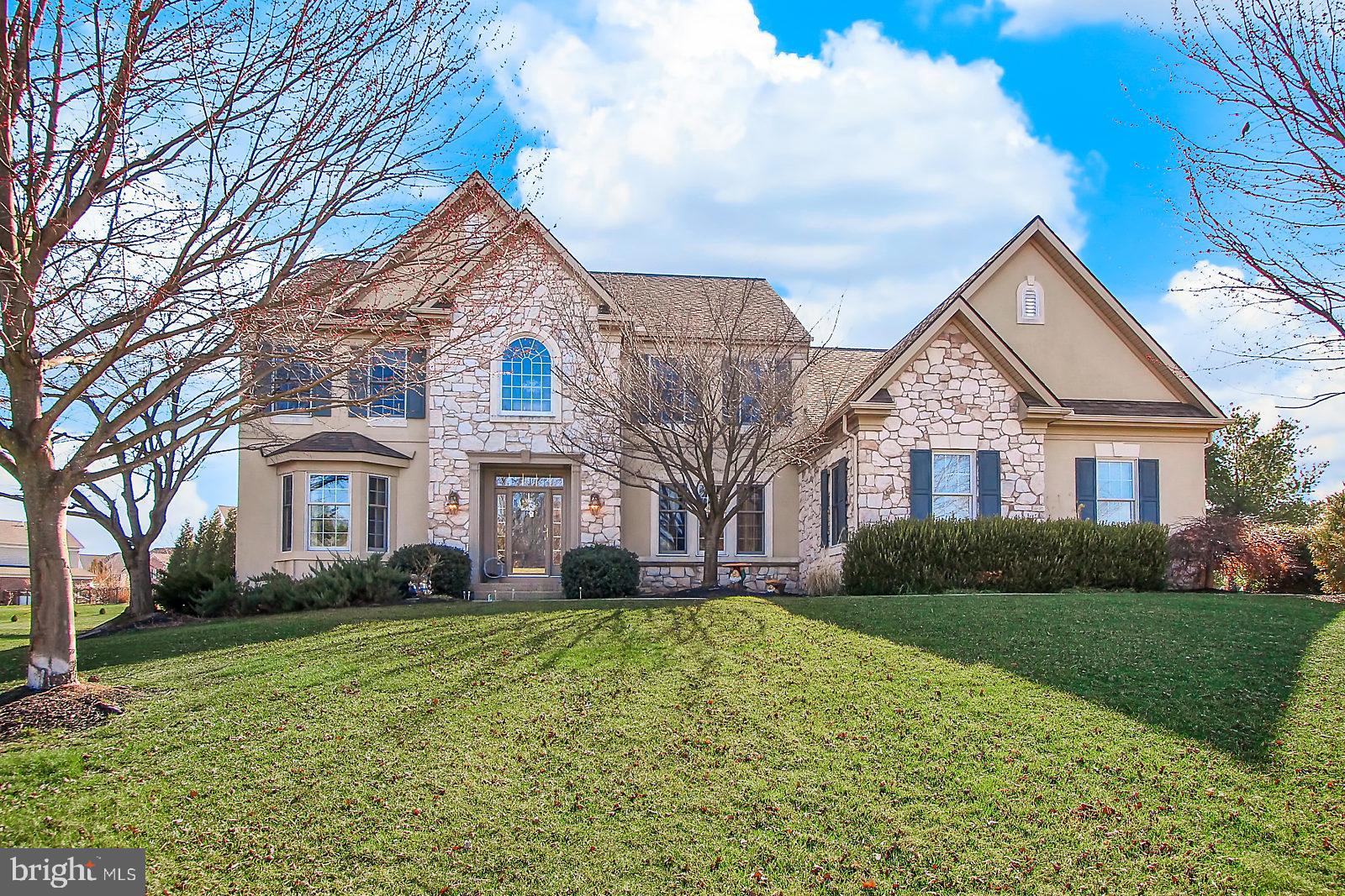 This home is a must see!  Living and dining rooms both feature Crown Molding.  Walk through to the Large open eat-in kitchen, with Corian counter tops, gas cooking range, double wall ovens, family room with columns and gas fireplace.  Large deck and patio make entertaining a breeze!  1st Floor bedroom/office with closet, Master bedroom has vaulted ceiling and sitting area with gas fireplace.  Master Bathroom has Jack N Jill walk-in closets, his and hers separate vanity areas, garden jetted tub, and tile walk in shower.  Bedroom 2 has Full Bath.  Find built-in desk areas in bedrooms 3 & 4.  Intercom system and central vacuum throughout.  Beautiful level lot, with fruit trees, rose garden, and play area, on over 3/4 of an acre!