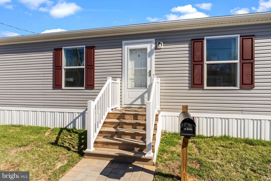 Welcome to 3429 Azalea Ave, a beautifully maintained mobile home built in 2022 that feels practically brand new. With 2 spacious bedrooms and 2 full bathrooms—including a private en-suite in the master bedroom—this home offers modern comfort in a clean, open layout. Step through the front door into a bright, open-concept living room that flows seamlessly into a stunning kitchen, perfect for both everyday living and entertaining. The home features newer storm doors and a newer washer and dryer, adding peace of mind and convenience. Down the hall, you’ll find a private laundry room with direct access to the backyard—ideal for easy, functional living. Each room in the home is generously sized, and the overall space feels fresh, airy, and barely lived in. Don't miss out on this opportunity for low-maintenance, easy living in a like-new home.  Monthly fee of $840 includes water, sewer and trash. Schedule your tour today!