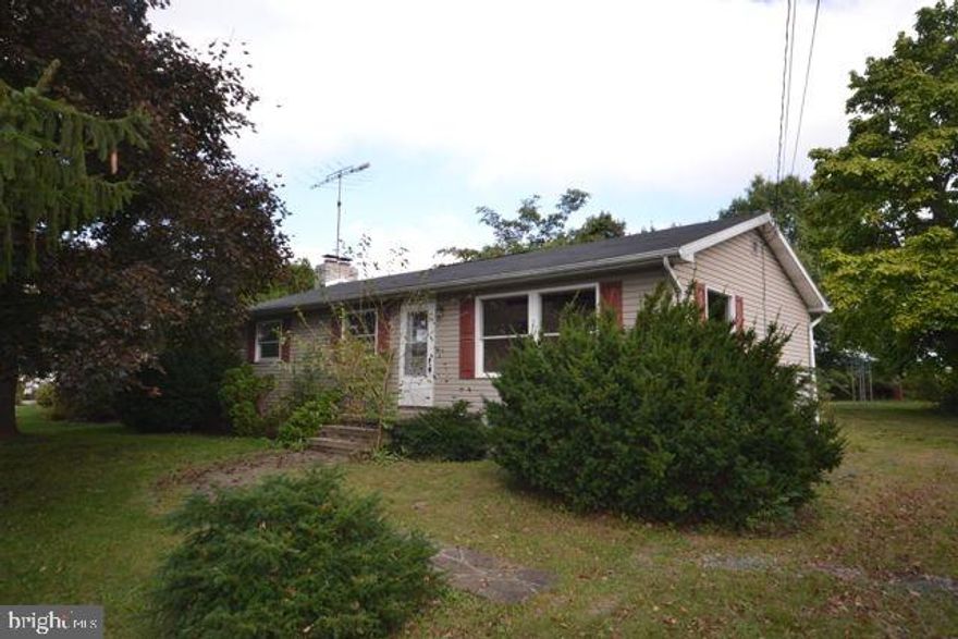 3 Bedroom Ranch in beautiful lake community!  Open living room and dining area, full basement with huge fireplace perfect for a lower level family room.  Detached garage with workshop or hobby room and lot backs up to open farmland for privacy.