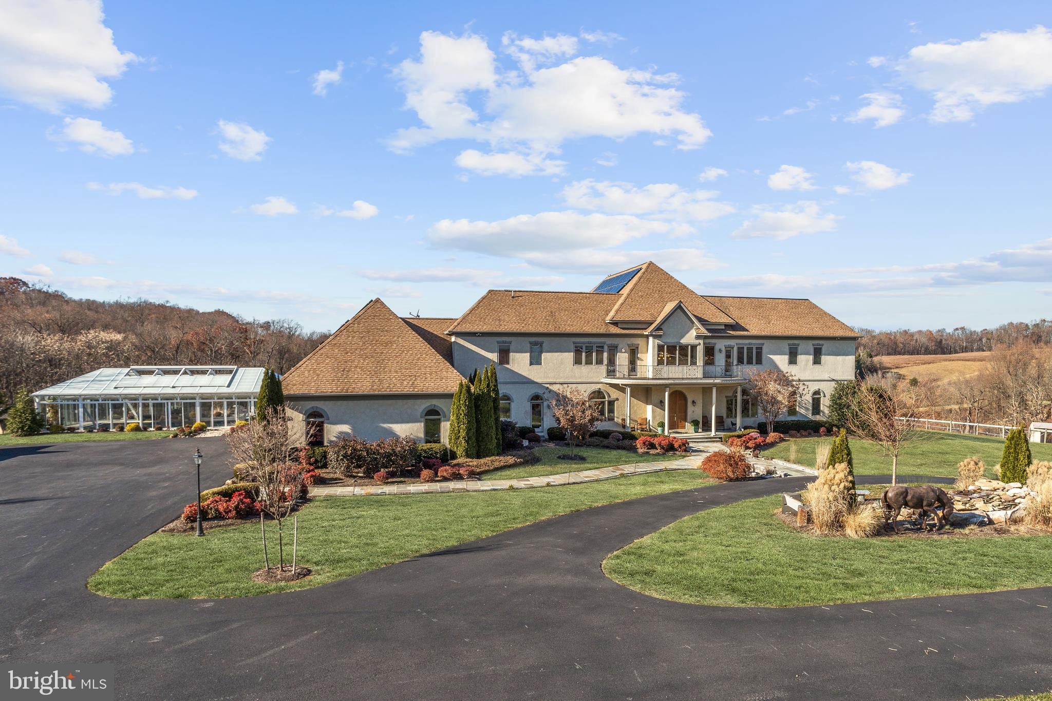 Accepting Back-up Offers! Welcome to Horseshoe Haven, a farm and luxury home on nearly 50 acres with breathtaking views of the Blue Ridge Mountains. This spectacular farm offers five paddocks with water, two run-in sheds, a barn with seven stalls, and tack room . Abundant hayfields, two supplementary sheds, a tractor barn, electric fence, streams and trails further enrich farm features, while a distinctive luxury home is perfectly situated to take full advantage of majestic mountain views. Purposeful design begins at the gated entrance, and drive flanked by green fields and horse paddocks that terminate at a dramatic fountain and bronze horse sculpture that announce arrival and punctuate the center of a generous circular drive. Outside amenities include an indoor-outdoor heated pool with a retractable roof that opens to the sky, and extensive landscaping with well-appointed hard scape and outdoor lighting. Outdoor living is paramount and featured amenties take full advantage of the privileged position paying homage to the mountain range view. An expansive covered patio unfolds to an open stone patio, garden bench, linear gas fire pit, and cooking pavilion.Inside, perfected mountainside living and entertaining is enhanced with radiant heat that subtly warms main level floors, whilst solar roof panels provide low cost energy. Gather well and gather often around a sweeping entertainer s curved island and kitchen sided by the greatest of great rooms, the Raven s game room and theater room. Completing the main level is a truly lavish master wing offering a private full wet bar retreat, a lavish walk-in closet, and a tempting spa-like bath. Experiential living expressed in thoughtful design, quality and fine finishes make this residence a very special luxury home, and the mountainside farm setting us unparalleled. Come home to Horseshoe Haven and a very special lifestyle. *Please note, lower level access is through the garage.