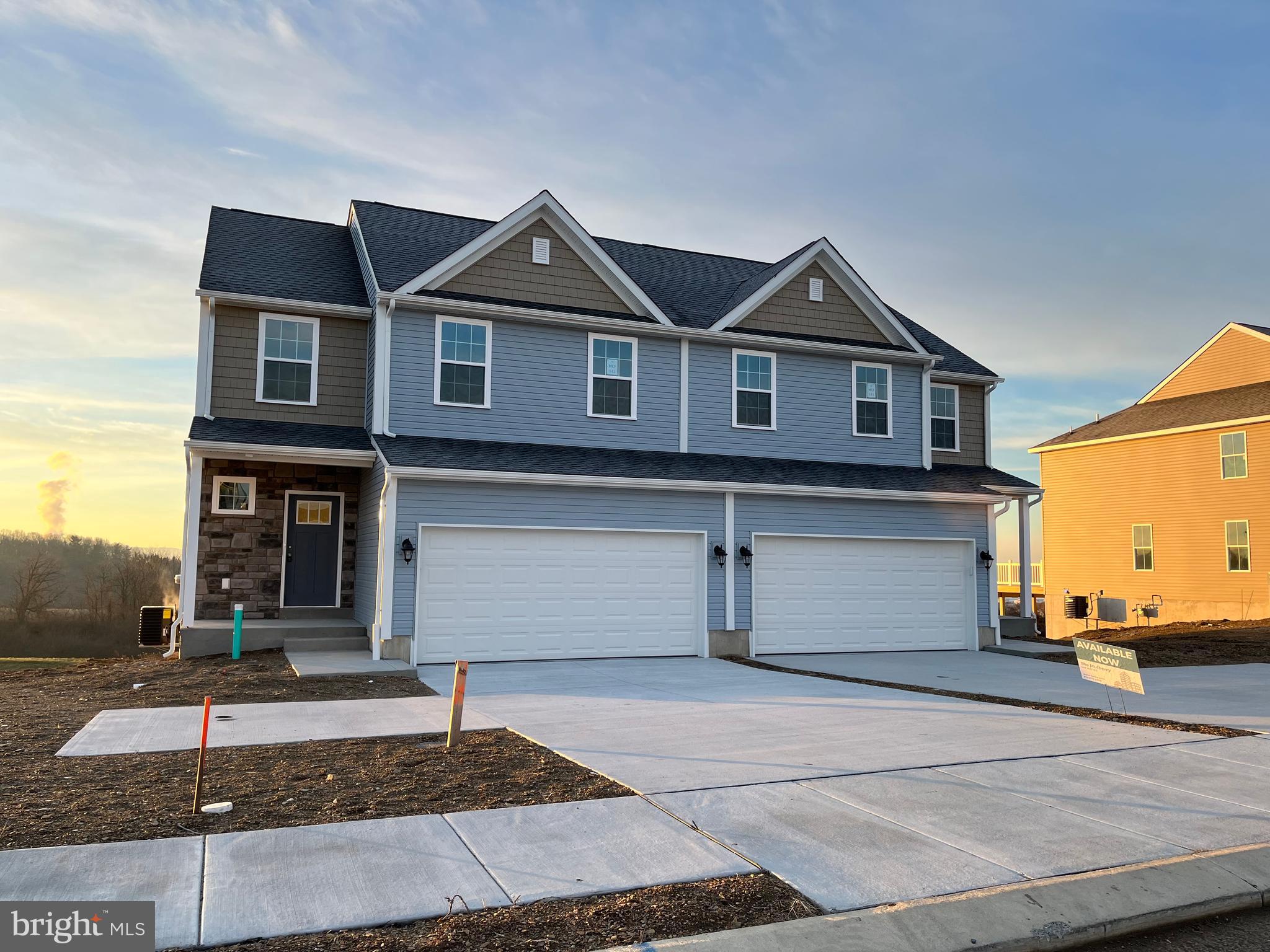 Take advantage of the 3% builder credit with this Quick Delivery Mulberry Model.  This beautiful semi-detached design offers a first-floor master bedroom, two car garage, and a beautiful exterior with vinyl shakes and stone accents. With just over 1,700 square feet, this efficient and affordable design has everything you need. The two-car garage provides ample storage space or can be transformed into a personal gym or work area.  Inside, you will find a laundry closet and spacious kitchen with plenty of counter space and a breakfast bar overlooking the dining room. Serving meals has never been easier! Tucked behind the kitchen and dining room is a large great room open to the loft area above! Quietly retire to the first-floor master suite that includes a walk-in closet and full bathroom! Upstairs, you will find two additional bedrooms, a flexible loft area and another full bathroom.  Welcome home to the Mulberry!