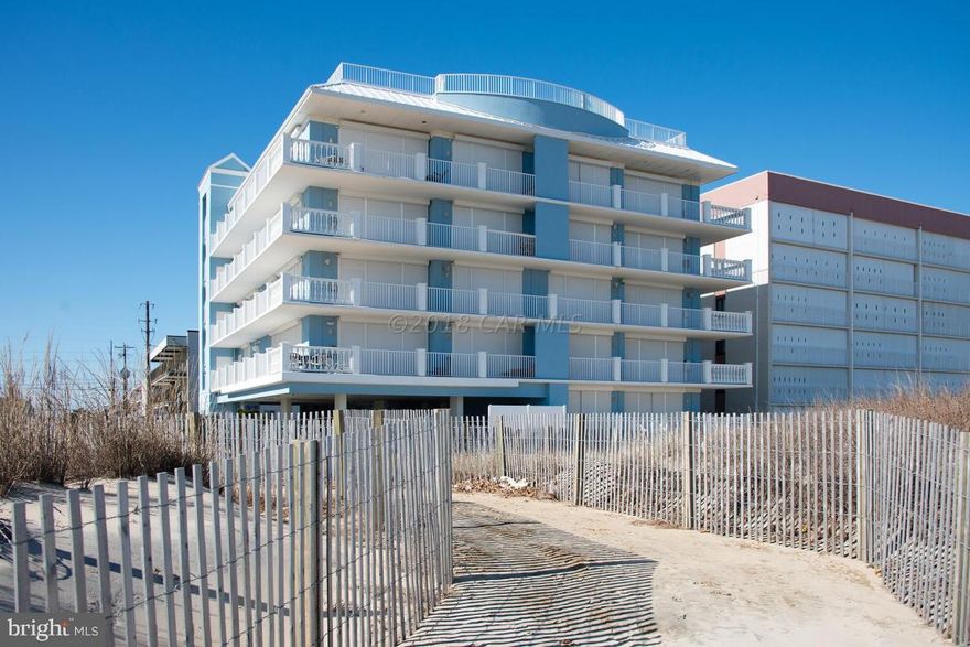 ONE OF A KIND OCEANFRONT CONDO! Absolutely beautiful 3BR 3BA top floor end unit with an oceanfront master suite and a magnificent wraparound balcony. The minute you walk in the door you will be overcome by the panoramic ocean views! Decorator furnished this luxury condo features beautiful furnishings with custom window treatments and bedding. Custom features throughout include crown molding, chair railing,10ft ceilings, custom kitchen with granite counters, gas fireplace, custom lighting fixtures and beautifully appointed baths. This small, non rental building features a fabulous roof top deck and outdoor pool! You can walk right out to the beach or enjoy long afternoons sunbathing at pool! If you are looking for that truly unique Ocean City Experience this is a ''MUST SEE PROPERTY''