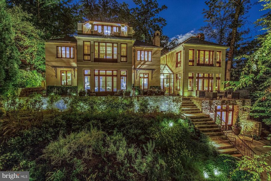 This 5 BR, 6.5 BA villa, sits on a 19,000+ SF hilltop in Massachusetts Ave Heights and has been graciously and extensively expanded over four levels. The 10+ foot ceiling main level features a Living Room, Dining Room, Great Room, Family Room, Kitchen, Powder Room and Office/Bedroom with ensuite bath. The private Master Suite includes a large walk-in closet and a second laundry room. The upper levels also provide 3 additional private bedroom suites. All of the entertaining spaces open to the expansive back terrace overlooking the green lot, hot tub, outdoor kitchen and fire pit. Windows cover the back of the home providing serene parkland views from all levels.  This special property is a do-not-miss!