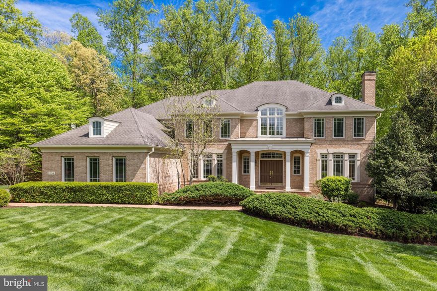 Introducing 9304 Fitz Folly Dr, an impressive brick colonial situated on 1.73 beautifully landscaped acres backing to trees. Incredible location in the heart of Great Falls, tucked away on a quiet cul-de-sac off River Bend Road. This meticulously maintained home features many upgrades throughout including hardwood floors, crown molding and trim, custom windows, recessed lighting, 4 fireplaces and more. You're going to fall in love with the spacious layout - perfect for family time and entertaining alike. A separate dining room and front sitting room cater to more formal gatherings while the light filled two-story living room is ideal for more casual family time. The eat-in kitchen features stainless steel appliances and plenty of room for entertaining. Enjoy the sun room off the kitchen providing ample natural light, the perfect space for a casual meal with loved ones. Rounding out the main level is a formal office with built-ins and french doors, two half baths, and a mud-room off the garage with laundry. 4 generous bedrooms upstairs include a primary suite with two walk-in closets, and a spa-like en-suite bath. The finished walk-out lower level includes a kitchenette, spacious living area, gym, and a full bedroom and bath. Utilize this space as an in-law suite, to host family and friends, or as a bonus rec-room for play time! The three car garage provides additional space for storage. Revel in the private and tranquil outdoor space. Enjoy a spacious deck off the kitchen, overlooking the wooded backdrop. Discover your green thumb with plenty of room for gardening. Close to tons of trails and recreation nearby at Great Falls Park. Located in the desirable Langley High School pyramid and minutes to Tysons Corner, I-495 and the GW Parkway, this is true lifestyle property in the heart of Great Falls. Welcome home!