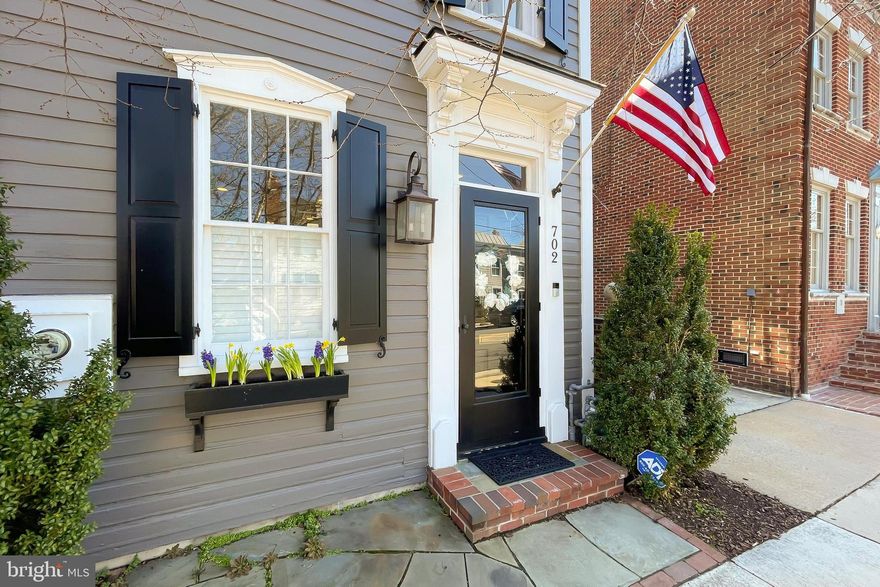 OPEN HOUSE CANCELLED, HOME UNDER CONTRACT!! don't miss out on this amazing home.  Welcome to this charming and historic detached row house located in the highly sought after Southeast quadrant of Old Town. This move-in-ready home offers a wonderful combination of old and new, bright and airy with tasteful updates throughout. The first floor boasts a cozy wood-burning fireplace in the living room, a formal dining room, and a rare large gourmet eat-in kitchen with custom inset cabinets and a pro Fivestar range top with stainless steel appliances and granite countertops. Enjoy endless evenings out on the private brick-walled patio garden with a custom-built TV enclosure and string lights – perfect for entertaining, outdoor movie nights, or relaxing under the stars. The upper level offers a spacious primary suite with a second wood-burning fireplace and a custom walk-in closet, a bonus small office space, and second full-size bedroom. Enjoy all of what Old Town living has to offer in this amazing home and unbeatable location – just a few blocks from the water, grocery stores, walking and bike trails, and elementary schools. Just a half mile to the restaurants and shops of King Street, which is close enough to walk, but far enough away to avoid the crowds. New HVAC installed in 2022.