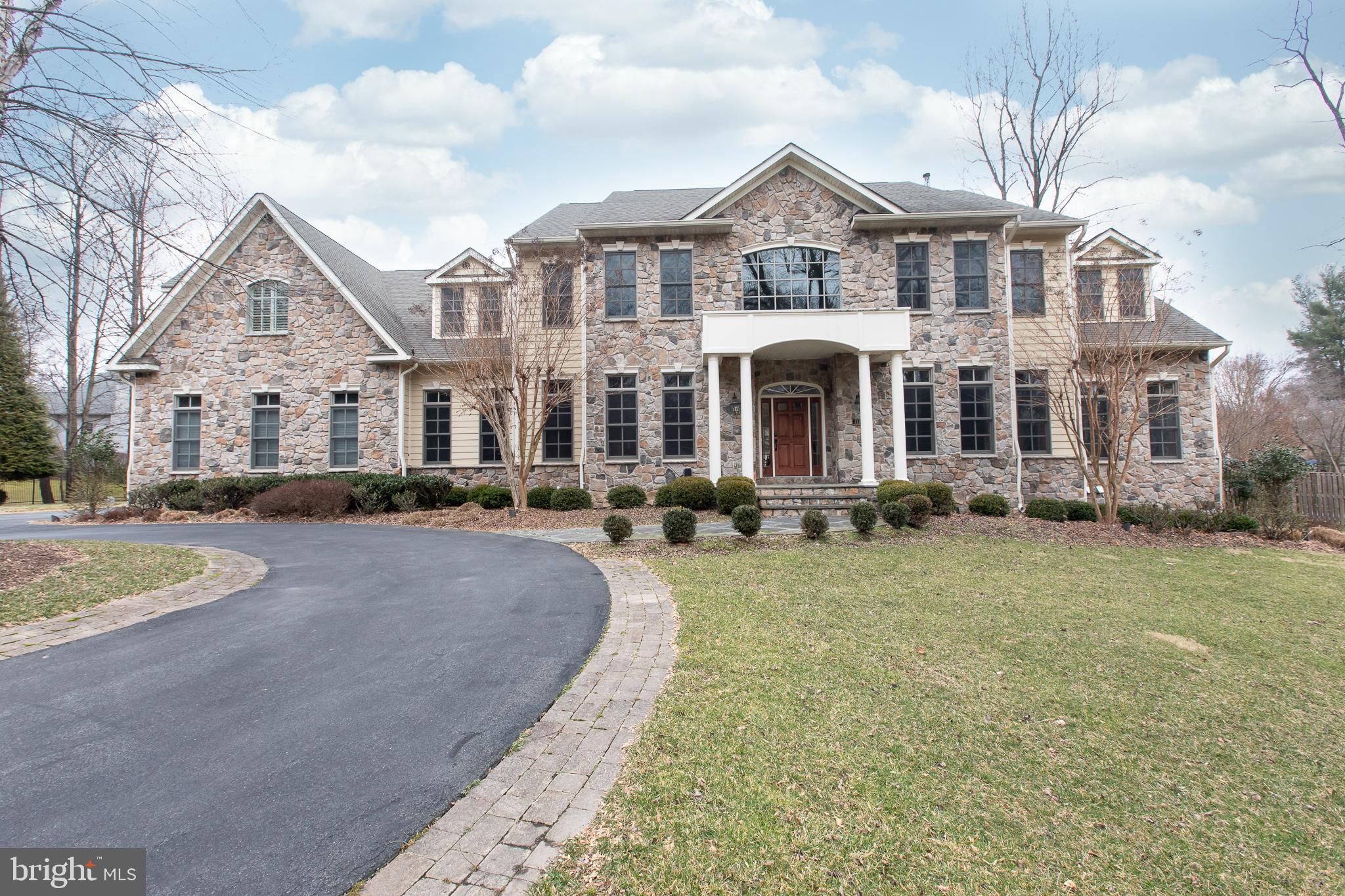 Price Reduced!!! Beautifully designed & expertly crafted home in 2006. Introduced by a charming stone front custom luxury house sitting on a 1+ acre level lot. 3 car garages and circle driveway, 5 bedrooms, 5 full bathrooms, 2 half baths, and 3 fireplaces. Two story foyer, crown molding throughout, 4.5-inch cherry floors in foyer, living, dining rooms and library. Large main gourmet island kitchen with high end appliance package and a surprise catering kitchen/butler's pantry, new island range hood blows that outside. Brand ceramic tile through breakfast area plus Second Kitchen. Fabulous family room with coffered ceilings, gas fireplace. Private office with hardwood floor & sun room with ceramic tile. Spacious master suite including 2 walk-in closets, & large sitting area with gas fireplace. New master bathroom with glass enclosed shower & free-standing tub. Walkup lower level with recreation room, media area and full bath. Maintenance free deck has a walk down to flat back yard. Professionally maintained landscape in the front and backyard. This property is perfect for commuters and it offers easy access to three international airports, the area's finest shopping and dining, highly rated public and private schools, wide range of museums and cultural centers. For the nature lovers, walk to the Billy Goat Great Fall Trail, Potomac Swim & Tennis Club. There are walking and biking paths along the picturesque C&O Canal and Potomac River. It s 2 Miles from Potomac Village, and a quick drive to DC & Tysons!