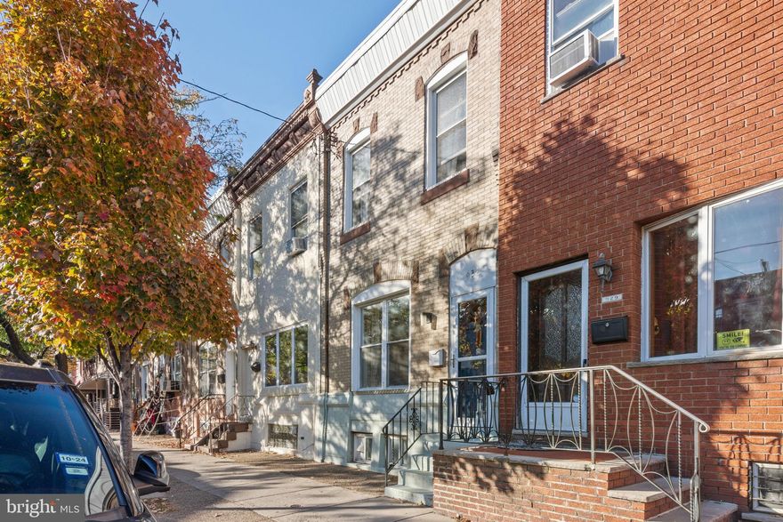 Welcome to 931 Wolf St, where charm and functionality converge in this delightful 3-bedroom home in Philly’s Lower Moyamensing neighborhood. Enter through the inviting vestibule to a spacious open-concept living and dining room featuring new hardwood floors that flow throughout the first level. The beautifully updated kitchen is a culinary haven with modern appliances and abundant cabinet and counter space. Out back, the oversized backyard is the perfect place for gardening, entertaining, or enjoying a quiet cup of coffee. Upstairs, all three bedrooms offer ample space and share an updated hall bathroom. Laundry is located in the spacious basement that had a new concrete floor poured in 2018 and provides generous storage space. All knob and tube wiring has been replaced. Not only is this home steps away from neighborhood favorites like Los Gallos and Frangelli’s Bakery, it also offers easy access to Broad St, East Passyunk, public transportation, and Mifflin Square Park. Schedule your showing today to see all that this lovely home and neighborhood have to offer!