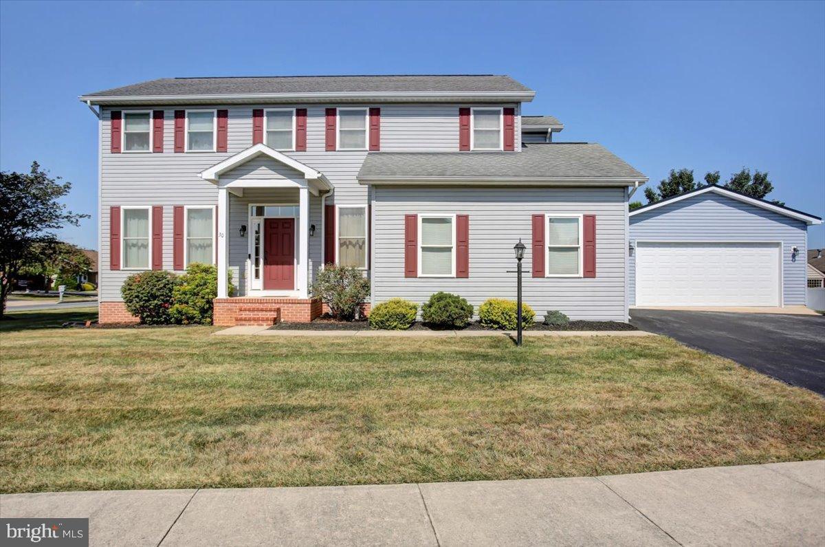 Nestled on a serene corner lot, this exquisite Colonial-style residence offers a harmonious blend of luxury and comfort, perfect for those seeking an elevated lifestyle. Built in 2003 by Don Wenger, one of the area’s premier custom builders, this home showcases exceptional craftsmanship, 2x6 framed walls for enhanced strength and insulation, and meticulous attention to detail, ensuring a warm and inviting atmosphere throughout. Professionally cleaned on a bi-weekly basis, it has been lovingly maintained both inside and out.
Step inside to discover a thoughtfully designed interior with three spacious bedrooms and two-and-a-half elegantly appointed bathrooms. The heart of the home is the gourmet kitchen, complete with upgraded countertops, stainless steel appliances, a reverse osmosis water system connected to the refrigerator and kitchen sink, and a generous island that invites culinary creativity. The open floor plan seamlessly connects the kitchen to the family room, where a cozy gas fireplace with a stunning stone mantel serves as a focal point—perfect for intimate gatherings or quiet evenings at home.
Natural light floods the living spaces through double-pane, low-E windows, enhancing the warmth of the hardwood and luxury vinyl tile flooring. The formal dining room offers an elegant setting for entertaining, while the primary suite provides a private retreat with a spa-like en-suite bathroom featuring a jetted tub and stall shower.
The fully finished basement adds valuable living space with an acoustical ceiling, rough-in plumbing for a future wet bar or sink, a walkout entrance, and ample storage—making it ideal for recreation, hobbies, or relaxation. Convenience continues with an upper-level laundry room, recessed lighting, and a sophisticated air filtration system for improved indoor air quality.
Outside, the property is equally impressive with a welcoming front porch, a spacious deck for entertaining, and beautifully landscaped grounds. The corner lot offers privacy and space, while the attached and detached garages provide ample parking and storage solutions.
Located in a peaceful neighborhood just moments from local amenities, parks, and recreational opportunities, this home perfectly balances tranquility and convenience. Every feature—from its quality construction to its thoughtful upgrades—has been designed to create a true sense of home.