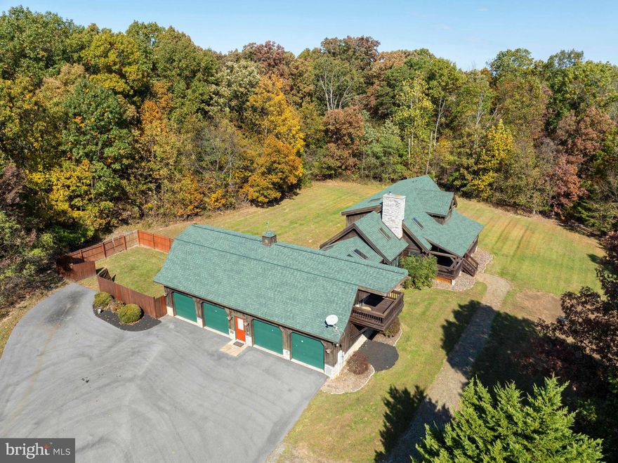 OPEN HOUSE SUNDAY 11/23/25  11am to 2pm

"Welcome to Your Own Slice of West Virginia Paradise: Custom Timber Peg Log Home on 4 Acres"Step into the tranquility of this custom-built true timber peg log home, nestled on 4 acres of scenic beauty. Overlooking a serene pond and surrounded by majestic mountains, woods, and the picturesque West Virginia countryside, this property offers an unparalleled retreat from the everyday hustle and bustle. Key Features: Rustic Elegance: Immerse yourself in the timeless charm of this true timber peg log home, boasting handcrafted details and unparalleled craftsmanship throughout. A hand-carved wooden spiral staircase takes you to the upper level. Outdoor Bliss: Relax and unwind on the oversized front porch, where you can soak in the panoramic views of the tranquil pond, rolling farmland, and wooded surroundings. Sit back on the porch swing and relax as the deer come to graze and the ducks come for a swim and the sounds of nature. Nature's Playground: With waterfront access and acres of land to explore, this property invites you to embrace the great outdoors. Whether you're fishing in the pond, hiking through the woods, or simply enjoying the sights and sounds of nature, there's something for everyone to enjoy. Luxurious Living: Inside, discover spacious accommodations with 4 bedrooms, 4.5 bathrooms, and a loft, providing ample space for family living and entertaining. The main floor master bedroom offers convenience and comfort, while the loft provides a versatile space for relaxation or recreation. Open floor plan is great for entertaining. Gourmet kitchen with top-of-the-line appliances. Guest Quarters: The oversized 4-car garage features an upstairs studio apartment, perfect for guests, extended family, or even as a potential rental opportunity. Unmatched Views: Wake up to breathtaking views of the surrounding mountains and countryside, and end each day with stunning sunsets that paint the sky in a palette of vibrant colors. This is more than just a home—it's a lifestyle. Don't miss your chance to experience the beauty and tranquility of West Virginia living at its finest. Schedule a showing today and make this extraordinary property your own! Easy commute to MD, VA, DC!