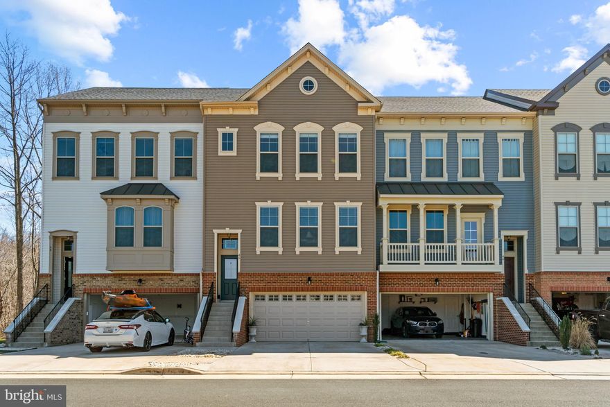 Welcome home to this beautiful luxury townhome in sought-after Colonial Forge! The main level boasts a bright and open floorplan which is great for entertaining! Any chef will LOVE the spacious eat-in kitchen with an abundance of cabinet and counter space, large island with seating, pull-out drawers, granite counters, pendant lights, and gas cooking. From the kitchen, step outside to a large composite Trex deck and enjoy your favorite beverage overlooking peaceful wooded views. The upper level has 3 bedrooms and 2 baths. The primary bedroom with attached bath features a water closet, separate vanities with lots of storage, ceramic tile shower with stiletto accent, bench, and walk-in closet. The lower level flex room is great for a hobby room, home office, or recreational room and has a full bath w/ marble vanity, ceramic tile floor, and shower. Walk outside to a lovely stamped concrete patio where you can relax and spend quiet evenings. The rear yard is fenced and has flower and herb gardens. Recent improvements include full bath on lower level, professional painting, Pergo flooring on main and lower level, 10x20 stamped concrete patio, 10x20 composite deck, and rear fence with gate. Living in Colonial Forge, you can enjoy the community pool, pavilion, dog park, tot lots, and sidewalks. Great commuter location! Close to Marine Base Quantico, FBI Academy, Commuter Lots, I-95, Embrey Mill Town Center with New Publix Grocery Story, Jeff Rouse Swim, and Sports Center (Gym Memberships Available). Excellent Schools and within Walking Distance to Colonial Forge High School! You don't want to miss this immaculate townhome situated with back wooded views.