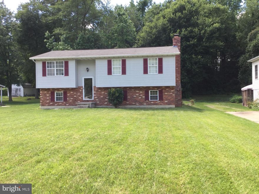 4 SPACIOUS BEDROOMS 1 HALF AND 1 FULL BATHS  REC.ROOM WITH COZY BRICK FIREPLACELARGE 2 STORY DECK THAT BACKS TO WOODS
