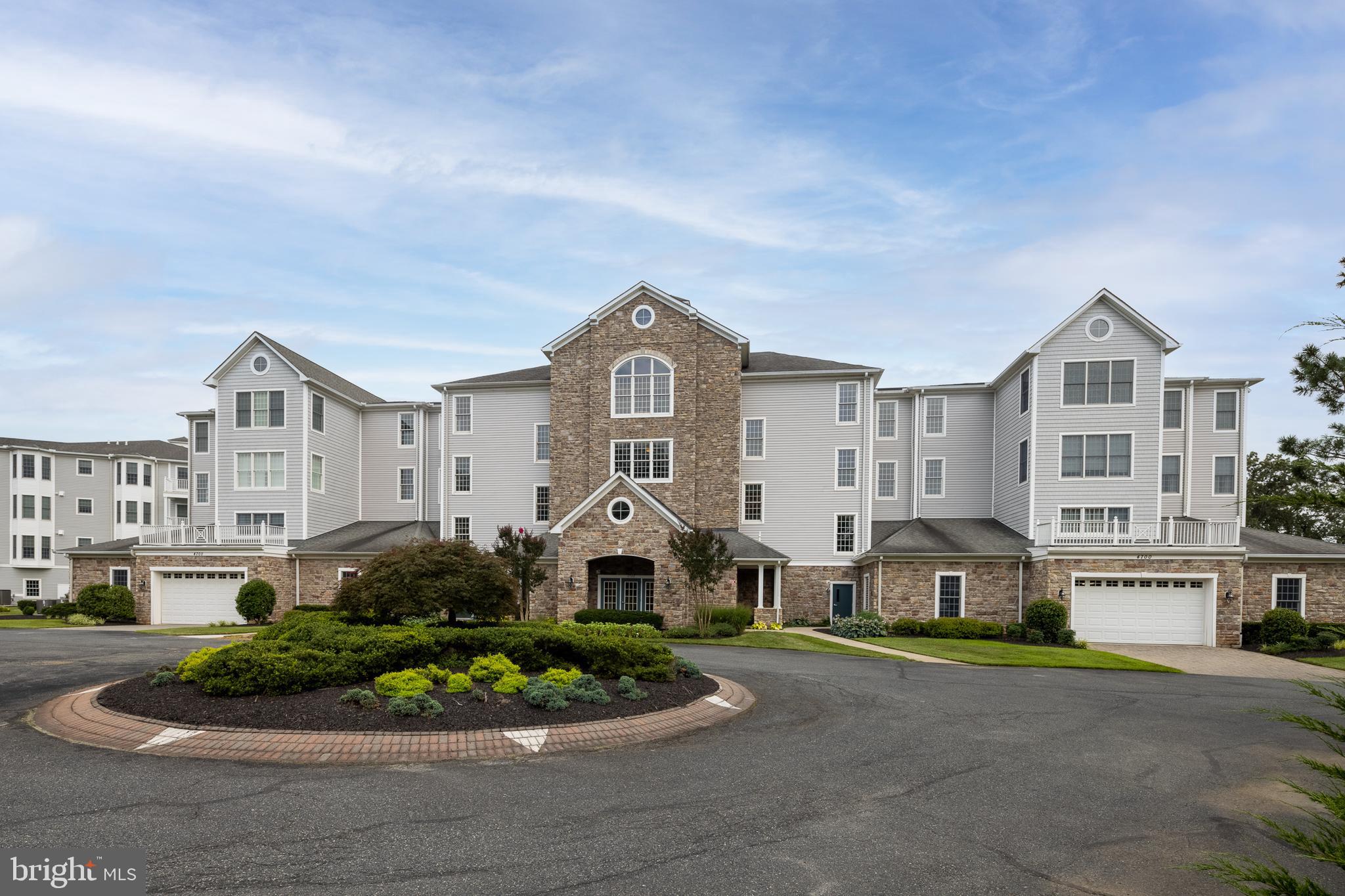 You're going to love the community of Waters Edge in Harford County! This beautiful waterfront community offeres a unique blend of tranquility and luxury living! There is no other development in Harford County like it! Situated on Bata Blvd in a private gated community, it provides residents with a waterfront lifestyle overlooking the Bush River and an abundance of wildlife. Once inside, every room of the condo offers expansive views of the river and its surroundings, creating a peaceful retreat with a one-of-a-kind view that must be seen. Residents enjoy a range of amenities such as a private pier for fishing and kayaking with a dedicated area for kayak and canoe storage, a clubhouse with kitchen facilities, meeting rooms, exercise facilities, showers, and an outdoor swimming pool and hot tub. Scenic waterfront walkways and meticulously landscaped, pet friendly grounds enhance the community's appeal. Interior features of this fabulous condo include elevator access, a parking garage, exterior parking, and a secured intercom system in your lobby for convenience and safety. Inside you will find panoramic waterfront views from multiple rooms. The gourmet kitchen is a chef’s dream, featuring stainless steel appliances, corian countertops, a double bowl sink, tile flooring, beautiful cabinetry, a breakfast bar, and a built-in desk—perfect for both cooking and casual dining.
The expansive living room is ideal for entertaining, with a large sliding door that opens onto a private waterfront balcony, seamlessly blending indoor and outdoor living.
The primary suite, which boasts private access to the waterfront balcony, two generous walk-in closets, and a spa-like en-suite bath with a soaking tub and walk-in shower. The second bedroom also enjoys private waterfront balcony access, perfect for guests or a home office with a view. A separate laundry room/storage area within the unit adds convenience and there is a separate storage unit in the garage. Waters Edge offers a lifestyle of comfort, security, and natural beauty, making it a standout community in Harford County for those seeking waterfront living with modern amenities.