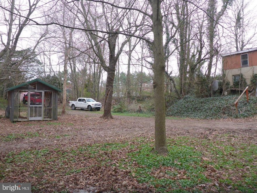 Attention Fixer Uppers...... This private property has almost 3 acres with a small older house and numerous outbuildings in varying degrees of condition. Could be ideal for the handyman, auto enthusiast, collector or others. Property is in need of much updating and repair. lease confirm with the Cecil County Planning & Zoning office regarding permitted uses. There is a well, septic and electric service at the property. Have never been used by current owner so not sure of their condition. Selling As-Is. Current driveway access is actually off Chesmont Ln. Nice private setting. Copy of survey plat and health dept well & septic info is available in the “Document” section. Call for further details.