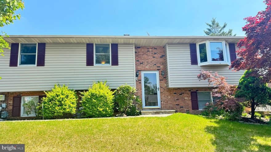 Nestled in the charming Perry Place subdivision, this exquisite split-foyer home—originally built in 1977 and thoughtfully renovated in 2019—offers a harmonious blend of modern elegance and classic comfort. With 2,440 square feet of meticulously finished living space, this residence is designed to cater to your every need. 
Step inside to discover a welcoming atmosphere accentuated by an open floor plan that seamlessly connects the living, dining, and kitchen areas. The gourmet kitchen features a spacious island, white cabinetry, recessed lighting, and ample table space for casual dining. Enjoy modern convenience with updated appliances, including a new stove, microwave, dishwasher, and refrigerator/freezer, all designed to enhance your culinary experience. The adjoining formal dining room provides an elegant setting for entertaining, while the family room off the kitchen ensures plenty of space for everyone to gather comfortably. 
This home boasts four generously sized bedrooms, including an entry-level bedroom that offers flexibility for guests or a home office. The bathrooms are thoughtfully designed with a walk-in shower and a stall shower, providing a spa-like experience. Additional interior highlights include gleaming hardwood floors on the main level, ceiling fans for year-round comfort, an attic fan for efficient ventilation, and beautiful bay windows that flood the home with natural light. 
The exterior is equally impressive, featuring a well-maintained yard with lush landscaping on a cleared 0.18-acre lot. Enjoy outdoor living on the inviting patios and porches, perfect for morning coffee or evening relaxation. The long, wide concrete driveway provides ample off-street parking. For extra storage, a convenient shed offers a practical solution for garden tools and equipment. 
The serene garden and lawn views create a tranquil backdrop, while the comfortable recreation area—complete with a wood-burning stove—makes a perfect spot to unwind. With four separate access points to the outdoors, this home is incredibly convenient for moving groceries or belongings in and out. With its combination of luxurious features, thoughtful renovations, and inviting outdoor spaces, this property is a true gem in Perry Place. Close to Shopping, Restaurants, and I-695.
