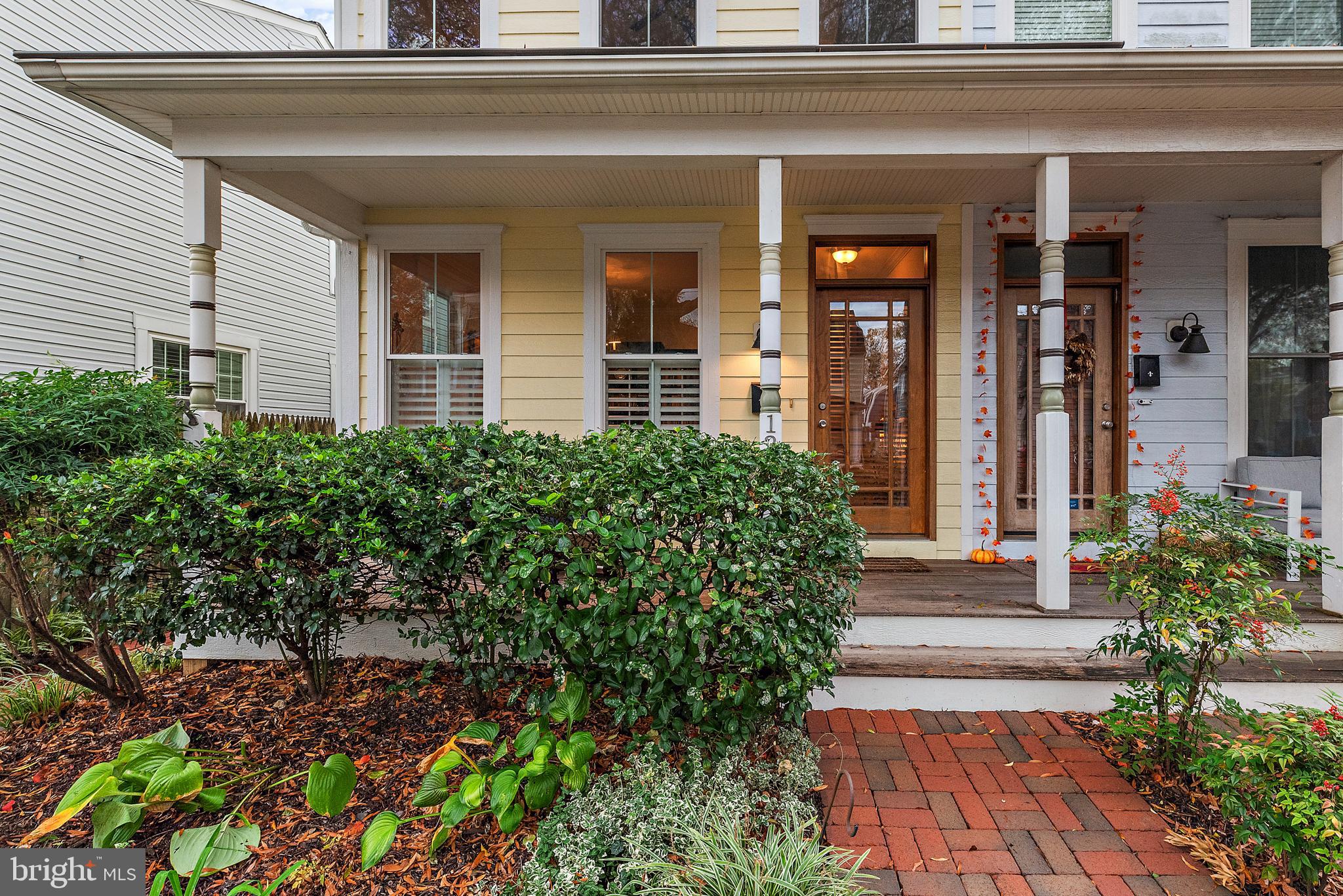 Classic Eastport townhome is light-filled and spacious with warm gleaming wood floors and high ceilings. Inviting front porch opens to formal dining room, updated kitchen and living room that flows to the private backyard. Kitchen has expansive granite counters that are ideal for large parties and have bar seating for casual dinners. Kitchen opens to living room with 9-foot+ ceilings, gas fireplace with heatilator, and glass door opens to the covered back porch and brick terrace. A private cottage in the back features one bedroom, one bath and living room w/ kitchenette. Perfect for added income! Full lower level in main house includes washer and dryer and is freshly carpeted and has one full bath. Lower level has outdoor entrance. Ideal for additional sleeping area, game room, media room or office. Second level has two large and bright bedrooms each with their own private bath. Fabulous Eastport lower peninsula location with easy walking to all the best restaurants, marinas. yacht clubs, and Annapolis Maritime Museum events.