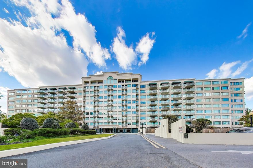 Exceptional Value for this 8th floor residence at the Whitley Park Condominium, including 2 indoor Garage Parking Spaces and in-unit Washer & Dryer.  Unit #806 is a bright and airy sanctuary, perfectly positioned to capture beautiful, elevated views. The true hallmark of this home are the large windows that line the walls, bathing the spacious interiors in natural light and creating an inspiring, light-filled atmosphere throughout.
Experience the ease of low-maintenance luxury within a thoughtfully designed floor plan that offers distinct living spaces. You'll find a spacious living room perfect for gathering, a separate dining area ideal for formal meals, and a well-appointed kitchen with ample cabinet space for all your culinary needs. Enjoy seamless indoor-outdoor living with a private balcony, perfect for sipping your morning coffee or unwinding in the evening. The home also boasts an expansive primary suite complete with a luxurious ensuite bath and walk in closet, offering a private retreat at the end of the day. 
As a resident of Whitley Park, you will benefit from an impressive suite of amenities, including a full-service concierge, on-site maintenance, an Olympic-sized outdoor pool, year-round indoor/outdoor tennis courts, and a fully equipped fitness center with a sauna. Not only does this unit convey two secure indoor garage parking spaces, it also conveys an extra storage space. Conveniently located just minutes from the Grosvenor Metro, I-495, and the vibrant shops and restaurants of Bethesda, this unit combines premium features with unparalleled access. This is your chance to own a sun-drenched, 8th Floor Unit where every day feels like a retreat. Welcome home!