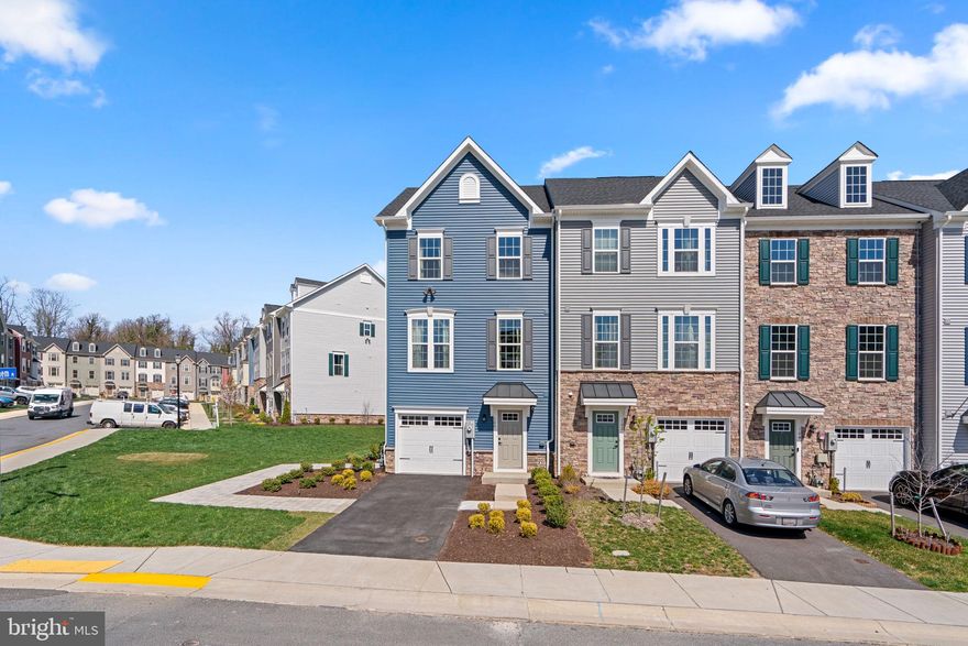 Stunning never lived in end-of-group townhome boasts a 1-car garage and the space of a single home.  A ground level foyer welcomes you to spacious fourth bedroom or rec room, and stairs to the open concept core main level offering a large living room,  a central gourmet kitchen and dining space with a large island perfect for entertaining. On the upper level, you find two bedrooms and a full bath and an owner’s suite with two walk-in closets and a dual vanity bath. Light-filled and ready to move in!