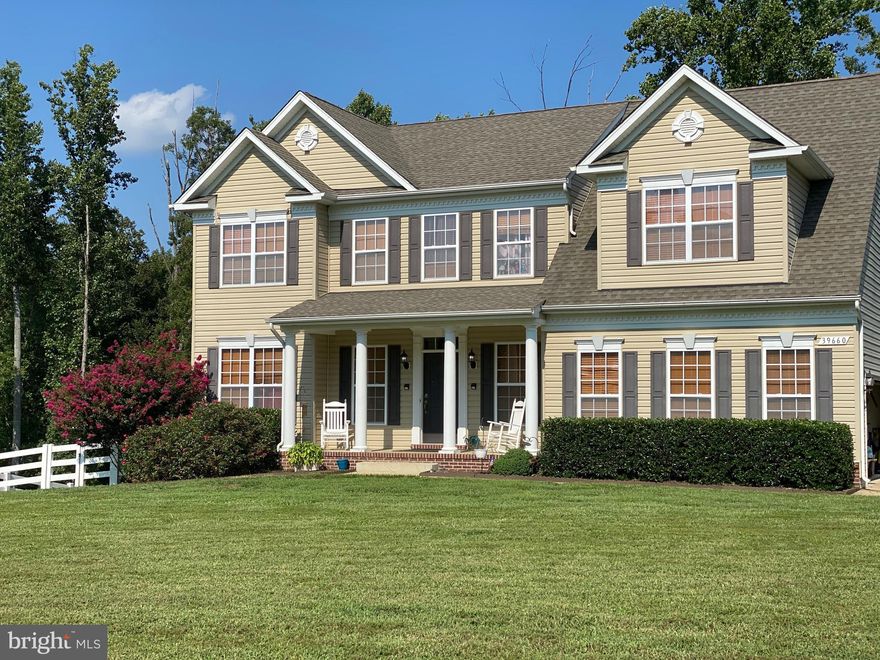 Built in 2012, this beautiful colonial with a 2 car garage and driveway with plenty of parking is situated on a little over 2 acres of land. Hardwood floors lead to a formal living room and formal dining room. The kitchen features upgraded granite countertops and a double oven. It is connected to a family room with a gas (propane) fireplace. A sliding door from the kitchen opens out to a beautiful Trex composite deck perfect for grilling while overlooking the wooded area behind the house. On the upper level, a large Primary bedroom features two walk-in closets and a sitting room with an adjoining primary bathroom that includes a large garden tub as well as dual sinks and a separate shower. Three more bedrooms and a full bath complete the upper level. The basement is fully finished with a full bathroom.