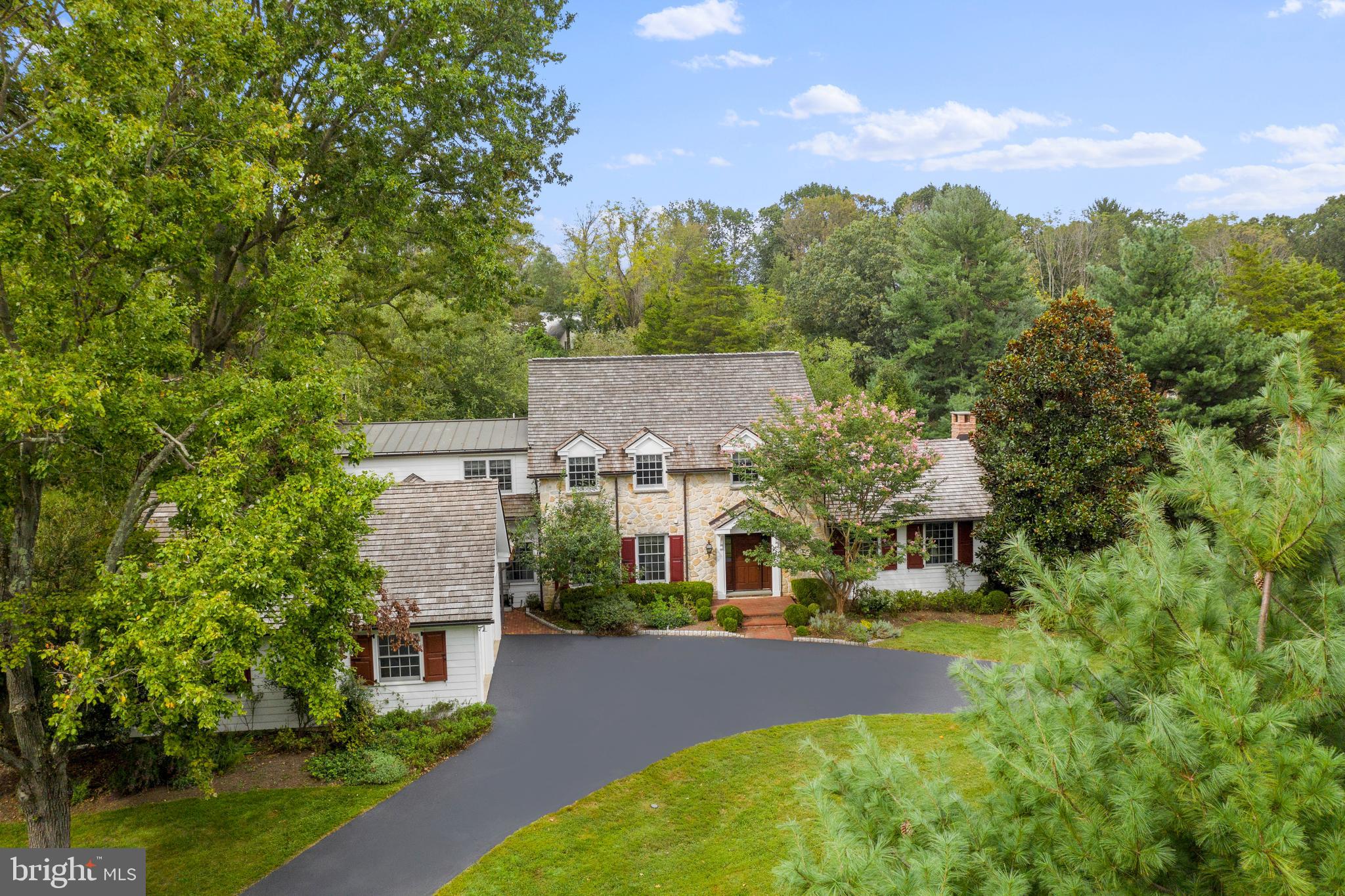 A golden opportunity!! Offering park like views from every window, this meticulously maintained stone Whitemarsh colonial with Hardie Board siding and a cedar shake roof will take your breath away! From the majestic curb appeal, this home is a rare find offering a quiet and picturesque cul de sac location steps away from Germantown Academy’s 126-acre campus in Fort Washington directly off the tree lined Sheaff Lane. This home has been completely renovated with the highest quality craftsmanship and materials….the first floor boasts a large gourmet kitchen with Wolf double ovens and 6 burner gas cooktop and Subzero fridge/freezer and Vermont verde countertops with rich mahogany island opening to a spacious family room with stunning wood burning fireplace and French doors to a large new patio overlooking the 1.7-acre private grounds. Trim and molding are old world charm and add to the beauty of the formal living room with fireplace and roomy dining room with a bright and sunny study with plenty of shelving and storage. The master suite is beautiful and spacious with large his and her walk-in closets and a classic Carrera master bath. 3 additional bedrooms and 2 full marble bathrooms and plenty of closet space and storage also on 2nd level. Oversized 2 car heated detached garage and brick breezeway are a lovely and welcoming top to the round-about driveway. Radiant heat floors in kitchen and family room, granite countertop laundry room with plenty of cabinets/ storage, stunning hardwood floors throughout, hard wired security system, recessed lighting, and speakers throughout. Minutes from downtown Ambler, PA turnpike, 2 train stations, The Highlands Historical Society, located in outstanding Colonial School District.