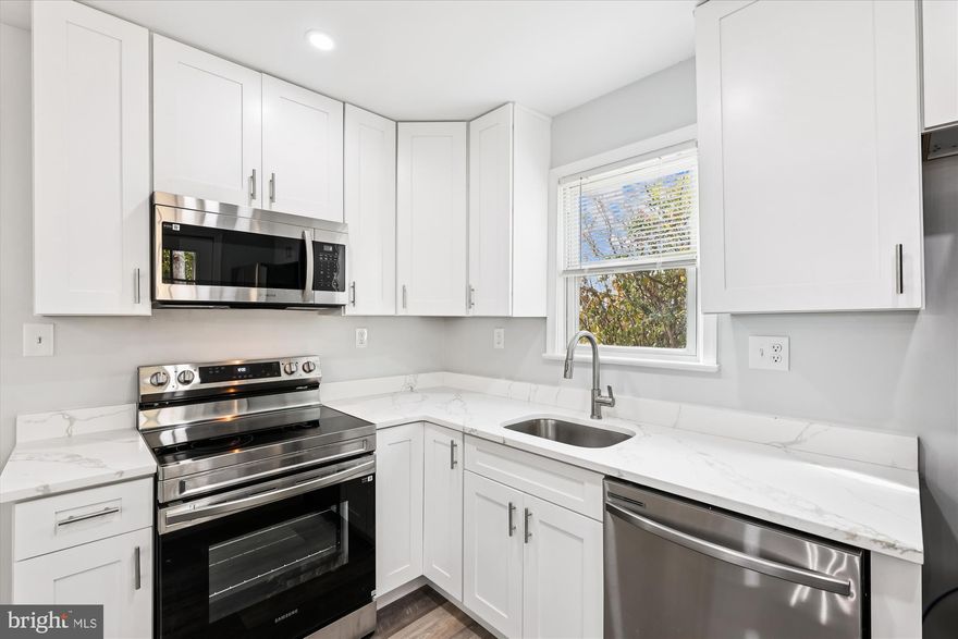 NEW PRICE REDUCTION! Welcome to 2016 Belfast Drive, a beautifully refreshed brick rambler nestled on a quiet street with sky tree-lined view in Fort Washington’s desirable Rosecroft Park neighborhood. This fully renovated home blends modern style with flexible living options and thoughtful updates throughout.
The main level features a brand-new kitchen with quartz countertops, elegant cabinetry, stainless steel appliances, and stylish fixtures. Fresh vinyl plank flooring, new paint, and upgraded electrical and plumbing fixtures enhance the home’s clean and inviting atmosphere. Two completely renovated bathrooms offer sleek, contemporary finishes and new vanities, adding to the home’s modern appeal.
The fully finished lower level provides even more living space, including a spacious recreation room with new flooring, an updated bathroom with new tile and vanity, and a versatile bonus room that can serve as storage, a gym, or a home office. Outside, enjoy the fresh landscaping, crisp exterior with classic curb appeal, large back yard that's great for outdoor events and shed for additional storage. Ample off-street parking in rear of property that could conveniently accommodate multiple cars. Located just minutes from restaurants, shopping, grocery stores, and major transportation routes, this move-in-ready home offers the perfect combination of comfort, style, and everyday convenience. Don’t miss your chance to make 2016 Belfast Drive your new home!