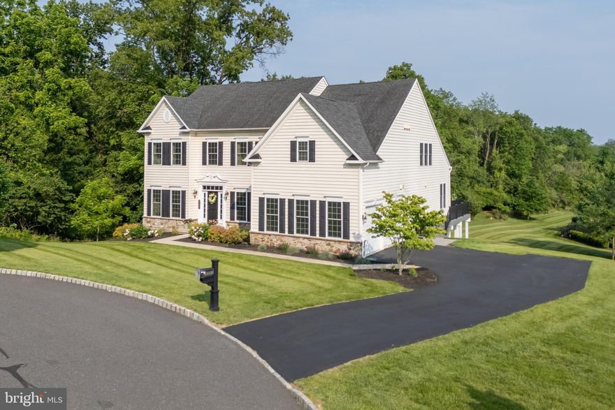 Located on a quiet CUL-DE-SAC in desirable Center Valley, this beautifully appointed 6 BEDROOM home offers over 5,500 sq ft of finished living space + a flexible floor plan across four levels. The main level features a bright TWO-STORY FOYER, espresso-toned HARDWOOD FLOORS, formal living room, dining room, and an open-concept kitchen and family room with GAS FIREPLACE. The kitchen includes granite countertops, custom cabinetry, center island, high-end stainless steel appliances, a walk-in pantry, and bar seating. A VAULTED BREAKFAST AREA filled with oversized windows opens to a expansive DECK with SCENIC VIEWS—perfect for relaxing or hosting. Upstairs, the spacious primary suite offers two walk-in closets and a beautiful en-suite bath with SOAKING TUB and separate shower. Four additional bedrooms include a Jack-and-Jill suite and a private en-suite. The third floor provides a PRIVATE SIXTH BEDROOM and full bath—ideal for guest or in-law accommodations. Additional highlights: Space for TWO HOME OFFICES, a combination laundry/mudroom with built-ins, an attached two-car garage plus a whole house GENERATOR. The finished WALK-OUT LOWER LEVEL includes a large recreation room, FITNESS ROOM & CLIMBING WALL. Looking for a low-maintenance lifestyle? HOA includes lawn care, snow removal & trash/recycling. Close to universities, hospitals, dining & shopping.