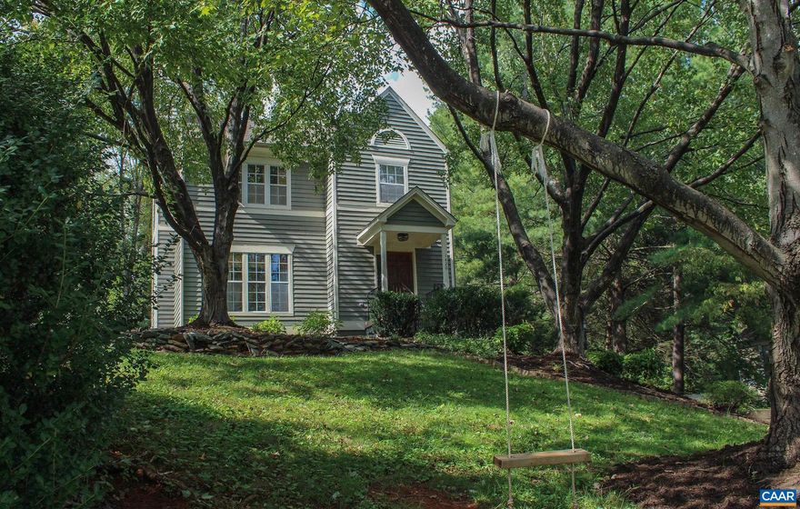 OPEN HOUSE TODAY, SUNDAY, OCT. 13, 2:30 - 4:00!!!  Adorable home in a highly desirable location, minutes from UVa, downtown mall, medical center, 5th street shops, etc.  This 3 BR home boasts a wonderful floorplan, a nice and open feel with cozy spaces too. There are 2 full baths and 2 half baths.  Beautiful hardwood floors throughout with inlaid woods in master bedroom.   Bright kitchen and baths were updated along with the roof in 2020.  All new plumbing in 2022. There's a large den in the basement, a home office and large laundry room here too.  Large deck extends outdoor living. The FENCED backyard is perfect for your pets.   Driveway for off street parking, allows two cars side by side.  Sellers hate to move, they love this community!!!  A wonderful place to live, you will love seeing this wonderful home.,White Cabinets,Wood Counter,Fireplace in Living Room