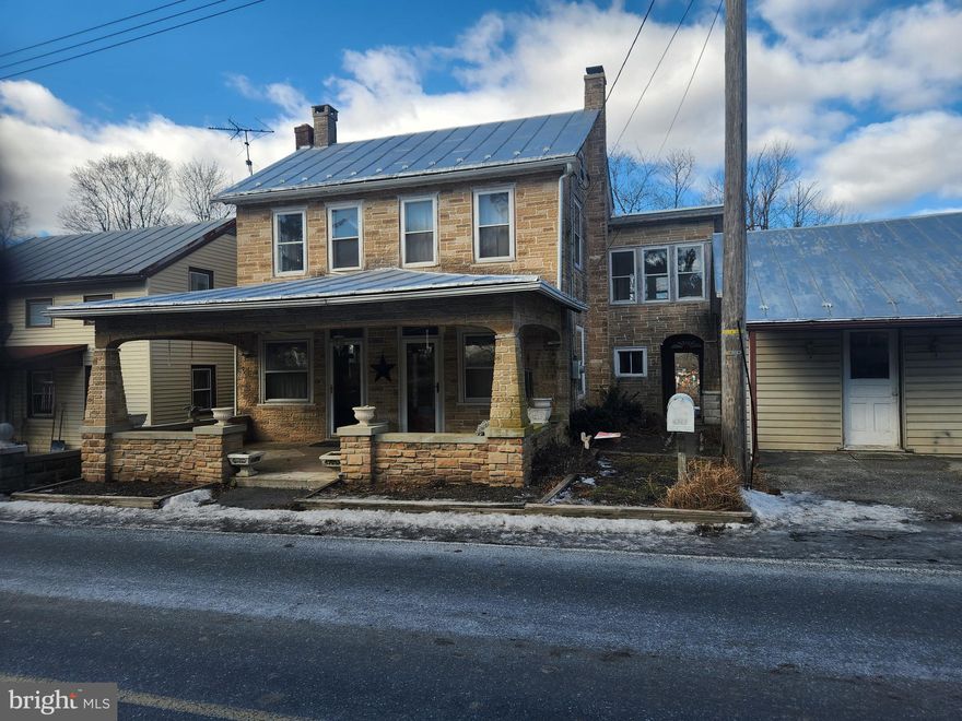 This property will be offered at Public Auction on Tuesday, April 8, 2025 @ 6pm.  The listing price is the opening bid only and in no way reflects the final sale price.  10% down due at auction, 2% transfer tax to be paid by the purchaser, real estate taxes prorated. This 4 bedroom investment property is nestled in a rural country property and offers a fenced in pasture with horse stalls. The first floor features a living room, a kitchen with basement access, as well as a family room. The second floor hosts four bedrooms, a full bathroom, and a sun porch. Additional amenities include an unfinished basement with laundry hookup, a powder room off the side porch, a detached garage, and convenient access to Routes 22 and 422. While this home is in need to considerable updating, it offers great potential.