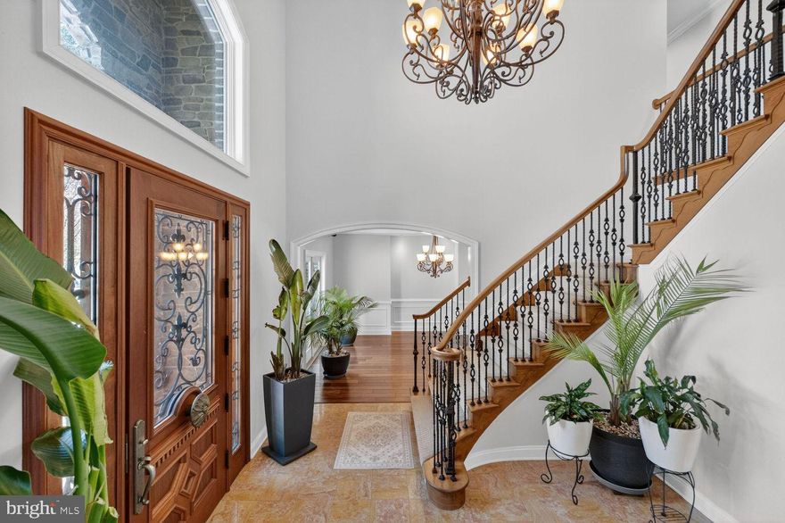 An extraordinary opportunity to own one of Frederick County’s most impressive custom estates. Secluded yet remarkably convenient, this one-of-a-kind residence sits on 7 private acres overlooking breathtaking views of Middletown Valley. Offering nearly 10,000 square feet of refined living space, the home blends privacy, sophistication, and modern innovation in a peaceful setting within a top-rated school district.

The main residence is thoughtfully designed for both grand entertaining and comfortable everyday living. A gourmet chef’s kitchen anchors the home, featuring custom granite countertops, cream cabinetry, premium Thermador appliances, an oversized island, and a sun-filled breakfast area. Formal living and dining rooms provide elegant gathering spaces, while the private office offers quiet productivity. The stunning family room showcases coffered ceilings, a fireplace, and a built-in bar — ideal for hosting.

Architectural details elevate every space, including a marble foyer with a dramatic curved staircase and wrought iron railings, rich hardwood floors, pocket doors, and extensive custom moldings throughout.

The luxurious main-level primary suite serves as a true retreat, complete with a sitting area, private balcony, fireplace, spa-inspired bath with steam shower, and a custom walk-in closet. Upstairs, three spacious bedrooms and two full baths offer comfort and privacy for family or guests.

A fully renovated in-law suite offers complete independent living with its own kitchen, laundry, full bath, bedroom with walk-in closet, and private deck — ideal for guests, extended family, or multigenerational living.

Designed with cutting-edge technology, the home is equipped with a state-of-the-art Savant home automation system with a dedicated in-home server, allowing seamless control of music, thermostats, televisions, alarm system, and intercoms for both front entrances. A fully integrated IT infrastructure includes a professional-grade server rack, firewalls, network switches, hardwired Cat 6 and fiber optic cabling, and 12 wireless access points providing exceptional indoor and outdoor coverage — future-proofed for speeds up to 10GB.

Security and peace of mind are paramount with a built-in surveillance system featuring 8–10 night vision cameras with motion monitoring capabilities. A whole-house water filtration system with carbon and UV purification enhances everyday living.

Outdoor spaces are equally impressive. A 40-foot heated fiberglass pool is surrounded by cool-to-the-touch travertine and complemented by a built-in audio system compatible with Sonos — perfect for entertaining. Multiple balconies, patios, and decks are positioned to capture the valley views, while evenings can be enjoyed around the newly installed smokeless firepit set within the wooded landscape, creating a serene and private retreat.

Additional highlights include a circular driveway, four-car garage, and convenient access to major commuter routes, shopping, and dining.