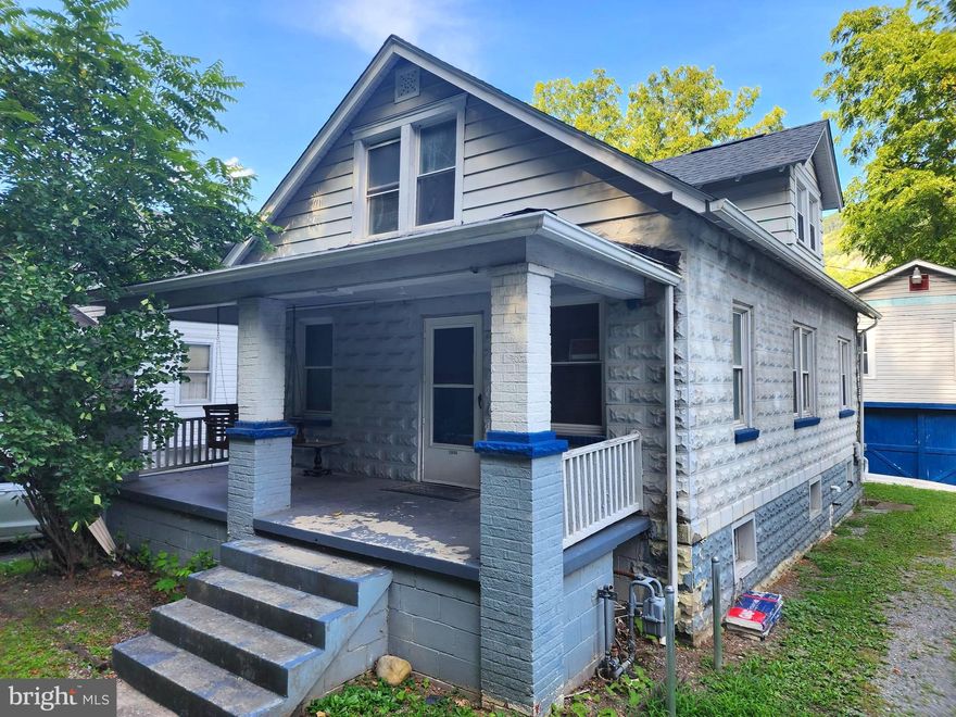 Welcome to 10806 Old Mount Savage Road in desirable Lavale, MD, nestled in Mountain Side of Maryland, This charming home features 3 bedrooms and 1 full bathroom and is move in ready just waiting for your personal touches. The 1st floor features new flooring throughout, multiple matching fans, and large rooms with separate dining room. Kitchen has matching black stainless steel Samsung gas
stove/oven, newer black stainless steel Samsung side by side refrigerator with ice and water in
the door. House has double pane windows with custom blinds that were installed throughout
the home. Full unfinished basement with updated electric. In addition, the hot water heater
replaced in 2017,brand new furnace installed in 2023, andcentral air conditioner serviced in
2023. New roof was completed in October of 2020. This house also offers a nice out door
space. It has front and back cement porches to relax on. The rear yard is private and has a nice
wooden fence. There is off street parking for 3 cars. Low Taxes! Over the garage is a hidden gem which is a diamond in the rough and can offer potential income with renovations. This 2 bedroom 1 bathroom apartment just waiting for you to bring it back to its former glory. Please be careful on steps going to the rear apartment.The possibilities are only bound by your imagination!