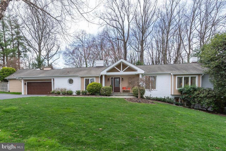 Welcome to a new way to live at 7800 English Way — an immaculate 4,320 sf contemporary ranch home in Bethesda’s desirable Burning Tree Manor. Walk in through the front entry or direct-access 2-car garage and be transported into an entertainer’s dream home, centered around a luminous chef’s kitchen with soaring cathedral ceilings, top-of-the-line appliances, abundant cabinetry, and a large island with built-in range.

Just off the kitchen is a chic-but-cozy family room — with soaring ceilings and skylights — and a charming breakfast nook with access to the home’s multi-level deck. Inviting dining and living rooms as well as a den/office round out the social spaces on the main level, while two full bedroom suites bookend the home. Each is a private sanctuary unto itself. The west wing primary suite is the larger of the two, adorned with vaulted ceilings, skylights, a private deck, two walk-in closets, and an expansive bathroom with soaking tub and walk-in shower. The east wing suite is equally well-appointed, smartly separated from the living spaces by a privacy corridor with its own garage entrance. Throughout the property, a smart home technology system allows for remote control of doors, lights, and cameras.

On the home’s lower level, the comfort continues. A second living room is warmed up by a beautiful stone fireplace (the home’s second) as well as dedicated spaces for card playing and drink making. Another bedroom suite is situated just off the living space, as welcoming as those upstairs with the added feature of a walk-in cedar closet. The home’s fourth bedroom is also located on this level, adjacent to a river-rock clad full bath with direct access to the pool deck and grounds beyond.

The backyard is a scene to behold. Mature professional landscaping, a generously sized free-form pool, and custom-built decking complete with screened-in gazebo and gas grill are everyday perks when you live here. Likewise, convenience is a given — moments from downtown Bethesda, Cabin John, and three of the region’s most prestigious clubs. Busy regional destinations like Rockville, Potomac, and Tysons are an easy commute via Seven Locks Road, River Road, and the Beltway. 

Get to know 7800 English Way, where entertaining is a must, connecting is a cinch, and relaxing is second nature.