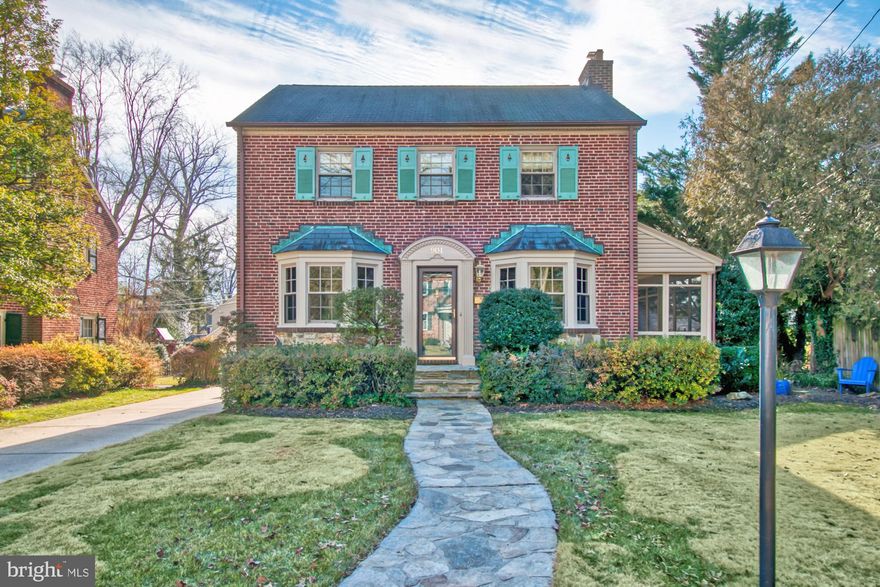 Fabulous classic 4 bedroom, 2 1/2 bath all brick Colonial in Historic Stoneleigh. Lovingly updated and impeccably maintained, this home is located on a quiet street, half a block from Stoneleigh Elementary School and a 5-minute walk from the community pool. Stunning oak floors gleam in all rooms (except kitchen and baths).  Traditional layout with lovely, large living room opening to a screened porch and family room. The cozy family room features a tall ceiling and brick walls with a sliding door to the private patio. The terrific dining room will easily accommodate a big family gathering (remember those??). The white kitchen boasts a brand new dishwasher and granite countertops. There is a half bath tucked between the kitchen and the living room. Upstairs you'll find a gracious master bedroom that can easily fit a king bed. Three closets provide plenty of storage. All bedrooms are generously sized. The floored attic is conveniently accessed through a walk-up stair in the 2nd bedroom. The newly carpeted lower level has loads of room to spread out, including a larger room and a small study or craft room. The laundry room has a wood-look plank floor and 1/4 bath. The roof is Slateline architectural shingle with 20 years remaining on the warranty. All the windows and the sliding doors were replaced with Anderson approximately 10 years ago. The high-efficiency gas boiler is approximately 5-7 years old. The central airconditioning unit was replaced in June 2019. Wonderfully landscaped with many interesting plant materials the level yard offers plenty of privacy with room to play or relax. The private patio and screened porch provide lovely places to entertain. The attached 1 car garage makes for wonderful storage. Walk to Starbucks, The Charmery (best ice cream in Baltimore!) bank, restaurants, shops, preschool through college! This home is freshly painted and in MINT condition- ready for the next owners. Interior pictures will be uploaded on Friday morning.