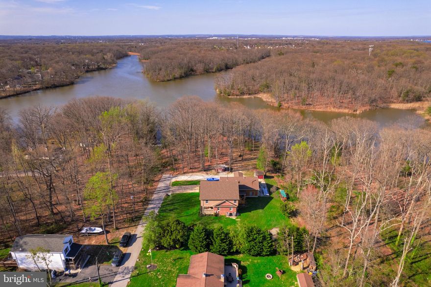 Possible 2 Building Rights, (Check with Baltimore County) Just under 1 Acre Including the 2 Additional Lots. Private Secluded,  Water View/Water Oriented.  6BD, 4FB, In-Law Suite In Basement, 1st Floor Bedroom & Full Bathroom. 4 Full Bedrooms upstairs with Master Suite Bathroom, Walk In Closet, 2nd Bathroom, Upstairs Laundry Room/ Laundry Chute.  Basement has Mudroom with Wood Stove & Second Laundry Room. Office/Bedroom. 4 Bay OVER-SIZED Climate Controlled GARAGE with Hydraulic Car Lift and Commercial Compressor.   3 Zone Heating & Cooling.  Garage has Upstairs Bonus Room with Workout Room and Wet Bar,  Outside includes Professional Landscaping  Fire Pit, Large, 2 Sheds, Driveway with additional room for Camper, Boat, Tractor, C Container whatever you want... Home also includes two additional Deeded Lots.  Extremely Private setting  last house on road with wooded buffer.  Free Community Boat Ramp Access, and Minutes from Rocky Point and Wilson Point.   Truly one of a kind property with outstanding craftsmenship and attention to detail.  Possibilities are endless.
Additional Deeded Lots included in sale -
Bring Total Acreage to .86 Acres

ADDITIONAL INFORMATION ON INTERIOR/EXTERIOR FURNISHINGS & MATERIALS:
Utilities brought in underground
30 year Certainteed algae resistant shingles
 Certainteed cedar impressions second floor main home
 All matching 3 ¼” colonial trim throughout all finished areas
 12’x16’ rear deck
 12’x38’ front porch295
 Bruce hardwood floors throughout main and 2 nd floors
400 amp service
Entire Home
5 1/3” OG baseboard throughout entire home
4 Full bathrooms with Toto toilets
Crown molding throughout entire home 3 zone HVAC system
Ceiling fans throughout
Front Porch
Blue stone side walk and front porch
 Beaded soffit
 All AZEK (vinyl) siding with fiberglass columns
Ceiling fans
Main Floor
KITCHEN
Stainless steel appliances
Solid wood Yorktowne cabinets
 Convection oven
Ample cabinets and countertops
 Pantry with pull-out drawers
 Garbage disposal
 Exterior vented ranger exhaust
Sliding glass door walk-out to rear deck and backyard
OPEN FLOOR PLAN AREA
 Shiplap
Tray-ceiling 
 Wood blinds
Milled handrail system
 Custom built-in
OFFICE
 Picture molding
Chair rail molding
Finished closet (shelving)
 French doors
SPARE BEDROOM
Crown molding
Chair rail molding
 Used currently as suite with connecting bathroom
Second Floor
 Bruce hardwood floor hallway
Carpeted bedrooms
Walk-in closets in all bedrooms
LAUNDRY ROOM
Spacious upstairs laundry room (organizers delight 
Tile floor
Sanitary sink
Washer/Dryer included
MASTER BEDROOM
Spacious master suite
Custom wood accent wall
Pocket door to master bathroom
Double vanity Antique claw foot tub
Cork floor 
Granite countertops
 California walk-in closet with amazing storage.
Access to attic
2 ND FLOOR BATHROOM
5’X8’ Full bathroom
 Toto toilet
Tile floor
Basement
 Kitchen area with refrigerator/sink/cabinetry
Tile Floor and carpet
Walk-in pantry
Customer built-in entertainment center
5x8 full bathroom
Office/bedroom with custom closet
 Mudroom with additional washer/dryer
 Sink and cabinetry
Wood burning stove
Rear enclosed entry to attached garage and bonus room.
Rheem premiere high efficiency heat pumps
All hard pipe insulated duct work.
Access to 400 amp service

Garage
MAIN LEVEL
Hardy board siding
AZEK vinyl exterior door and trim
100 amp service
3 bay (4 car garage)
12ft ceilings
Oversized insulated garage doors
Access to second electrical panel
BONUS ROOM
Anderson 400 series windows
Custom bar
 Overlooks water view
Exercise room