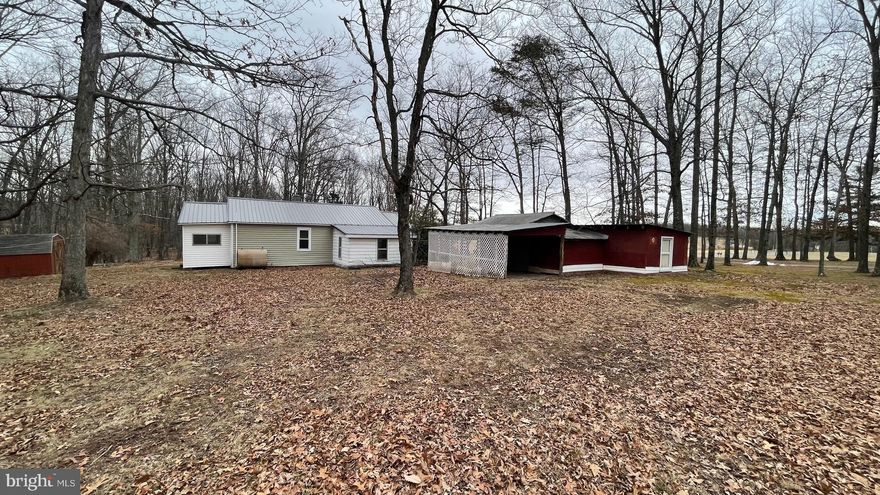 REDUCED!!!!Call today to see this ranch style home located just short drive to shopping, dining, banks and doctors. This home has 1,052 sq ft of living space and offers 2 bedrooms and 1 bathroom making it the perfect size for a starter home or those looking to down size.  It sits on an unrestricted .45 acre lot that is mostly level with mature trees surrounding the home. Bring your vision and with a little TLC, this home can bring your dreams of living in the beautiful mountains of West Virginia to fruition. New 200 amp Electrical panel installed, new metal roof, plumbing has been updated and newer oil furnace. If you are looking for a weekend get-away or airBnB investment, this home is in a great location. It is about 9 miles from the Hampshire Square Shopping Center and the hospital, and a little over 11 miles from the heart of Romney. Romney is one of the 2 oldest towns in West Virginia and people love to visit to take in the scenic beauty, visit Civil War sites and of course, ride the Potomac Eagle Scenic Railroad. There are vast recreational opportunities from hiking to canoeing or fishing the South Branch of the Potomac River that flows through. This home is about equal distance from Springfield, Slanesville and Romney. So just pick a direction and explore all that Hampshire County has to offer! You are also less than an hour drive from I-68 / Cumberland, MD and I-81 / Winchester, VA.