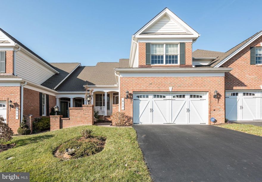 Three finished levels in beautiful 55+ community, updates include: plantation shutters, hdwd floors on main level, luxury flr in lower level w/ walk- out access to paver patio, full bath & work/storage area. Kitchen boasts 42" cabinets, granite & stainless.  Family room w/ stone fpl & access to maintenance free deck w/ steps to grnd level. Lovely 1st floor master offers walk-in closet & spa bath.