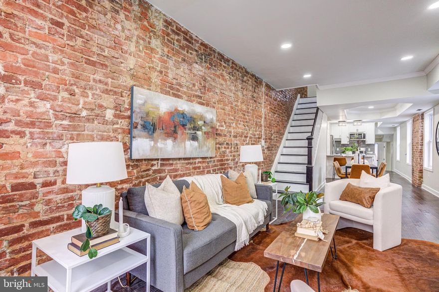 WELCOME HOME TO  2718 E MADISON!! YOU WILL FALL IN LOVE WITH THIS  METICULOUSLY RENOVATED 4 BR, 3.5 BA 3-LEVEL TH WITH OPEN FLOOR PLAN.  EXPOSED BRICK,  GLEAMING H/W FLOORS.  RECESS LIGHTING THROUGHOUT.  RENOVATED KITCHEN w/42" WHITE CABINETS, GRANITE COUNTER, BACKSPLASH, SS APPLIANCES. GAS STOVE, SEPARATE DINING AREA.  SPACIOUS MBR ENSUITE W/ DECK .  THREE MORE SPACIOUS BEDROOMS  WITH FULL BATH.  FULL BASEMENT HALF BATH, SPACIOUS REC ROOM, NEW WINDOWS, DOORS, HVAC SYSTEM, WASHER/DRYER.