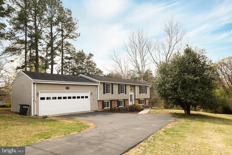 This property offers all the advantages of Great Falls living! Enjoy sidewalks for nightly strolls, proximity to parks, and easy access to State Route 7, Georgetown Pike and Great Falls Village Center, which lends itself to crowd avoidance on weekends. Improvements include: freshly painted both floor levels, new carpet, new flooring on the lower level, huge garage with storage, spacious laundry room with cabinets and utility tub, newer appliances, walkout basement to fenced yard, beautiful oak HW flooring upstairs, well-maintained garden bed, well-maintained septic, refinished private deck, remodeled bathrooms with upgraded finishes, skylight, and more! The downstairs area provides a separate living space for teens, grandparents, crafts, or that man cave. The large, private yard gets you the quiet time you need away from the busy city. The Great Falls location is WAY more convenient than locations "further out" (saving up to 1 hour per day in the commute). Metro is an easy 10-minute drive away. Langley High School Pyramid. Cooper Middle and Forestville Elementary School.