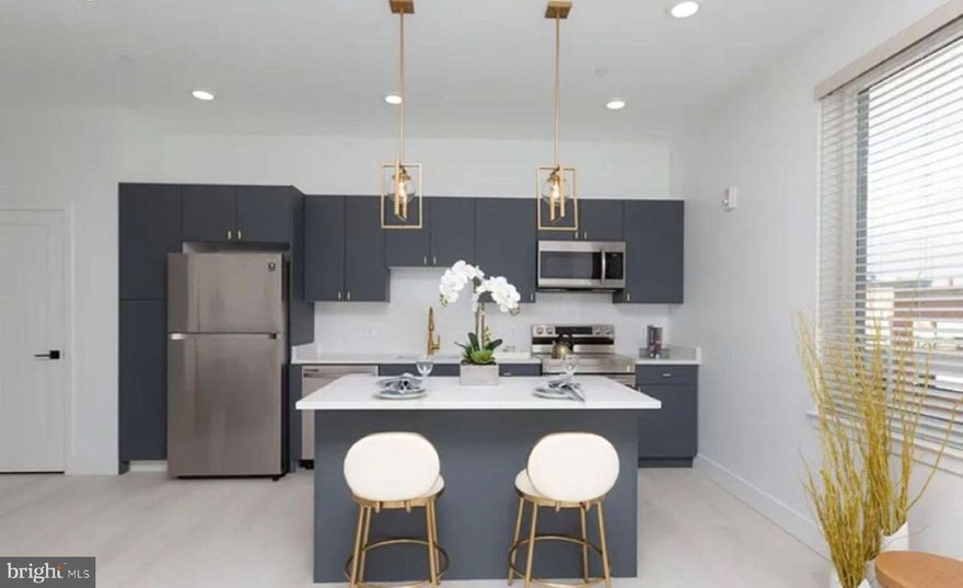 First Month of Rent is Free!

Discover your ideal apartment in The Caroline, where luxury living meets historic charm in the heart of Fells Point. Nestled in this picturesque neighborhood, our stunning apartments offer a refined living experience.

Built in 2021, these new apartments step into open floor plans with soaring ceilings, creating an airy, welcoming ambiance that's flooded with natural light. Your gourmet kitchen, adorned with sleek stainless steel appliances and black matte hardware, will inspire your inner chef. The custom walk-in closets, quartz countertops, engineered hardwood flooring, Philip Jeffries wallpaper, and posh lighting add more than a touch of opulence to your everyday routine as shown in the model home photos.

Welcome to Fells Point, where charming cobblestone streets meet the waterfront. This pedestrian-friendly neighborhood boasts an array of bars, top-rated restaurants, and boutique stores. It's also home to one of Baltimore's most luxurious hotels, The Pendry. Explore historic streets, savor a lively culinary scene, and immerse yourself in the rich history and vibrant culture of this unique Baltimore neighborhood.
Your oasis at The Caroline awaits, and we are ready to help you find your dream apartment!